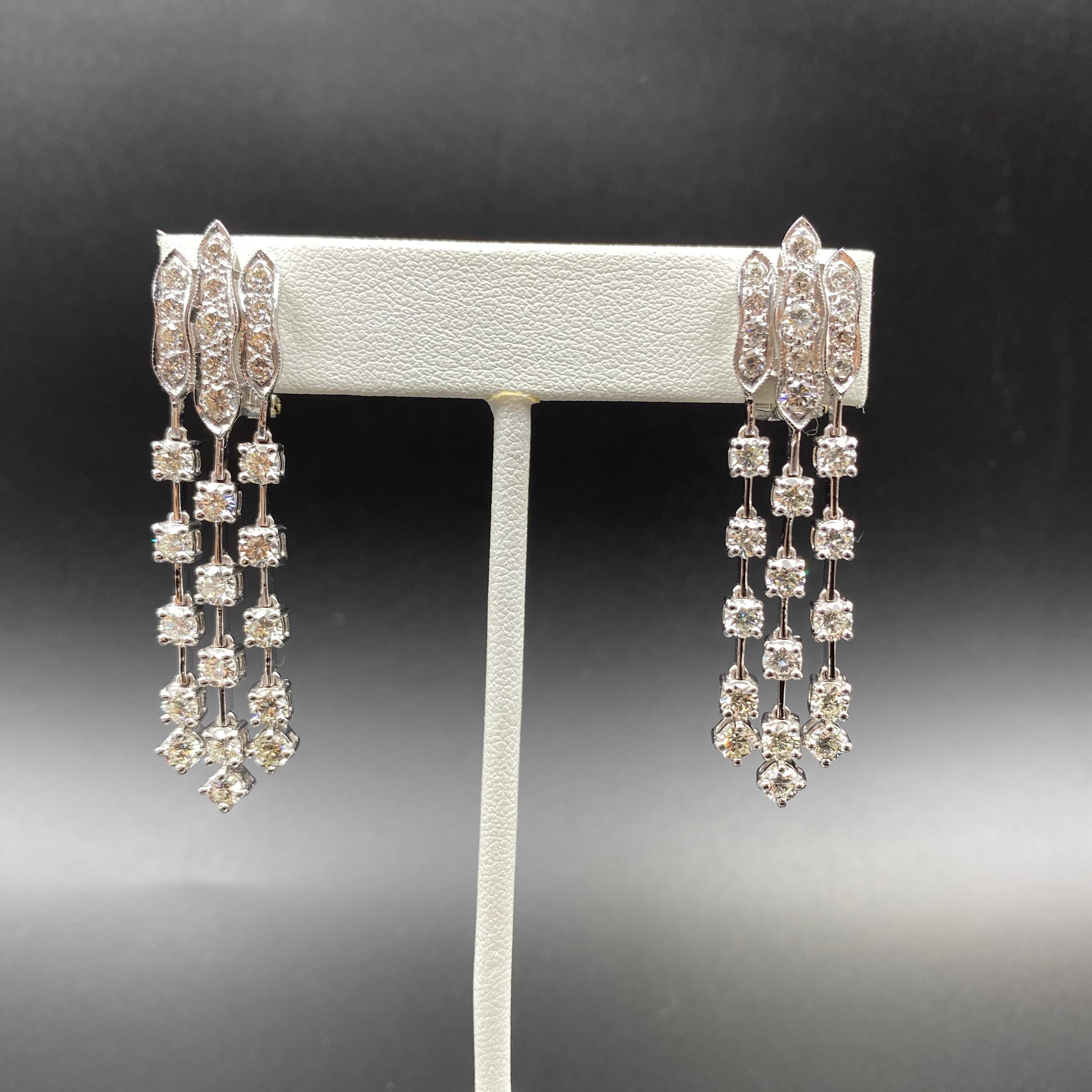 A timeless design, the String Earrings feature a string of round brilliant diamonds, set cascading in row, made in 18K white gold. 

Diamond Details
Shape Round Brilliant 
Color F 
Clarity VS2 
Total Diamond Weight: 6 carats 

Earring Information