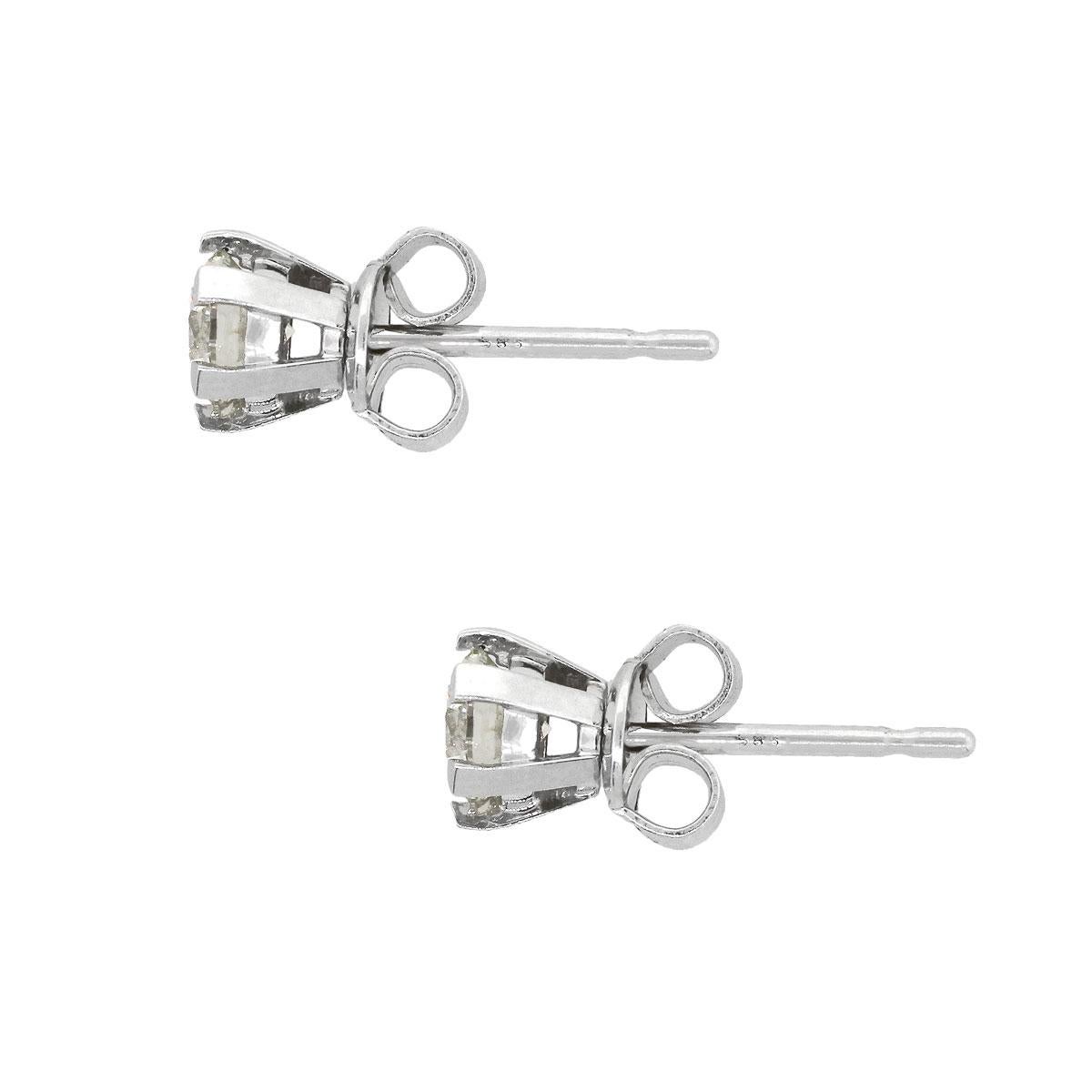 Material: 14k white gold
Diamond Details: Approx. 0.85ctw of round brilliant diamonds. Diamonds are I/J in color and SI in clarity
Measurements: 0.61″ x 0.23″ x 0.23″
Earrings Backs: Tension post
Total Weight: 1.4g (0.9dwt)
SKU: A30312424