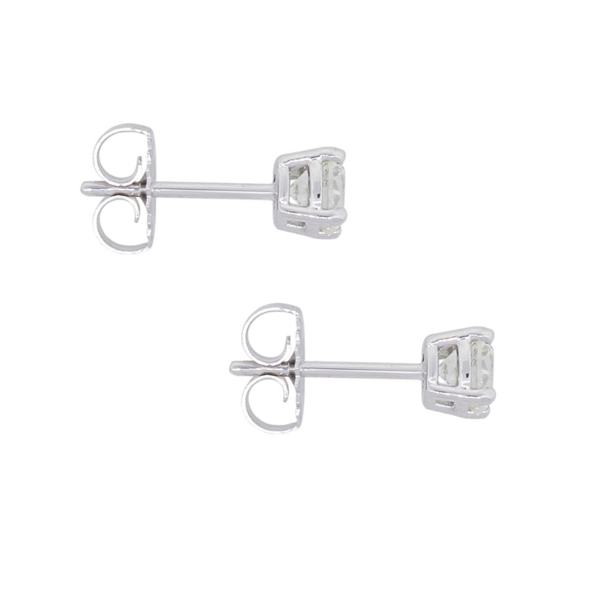 Material: 14k white gold
Diamond Details: Approx. 1ctw of round brilliant diamonds. Diamonds are G/H in color and SI in clarity
Measurements: 0.58″ x 0.19″ x 0.19″
Earrings Backs: Post friction
Total Weight: 1.3g (0.8dwt)
Additional Details: This