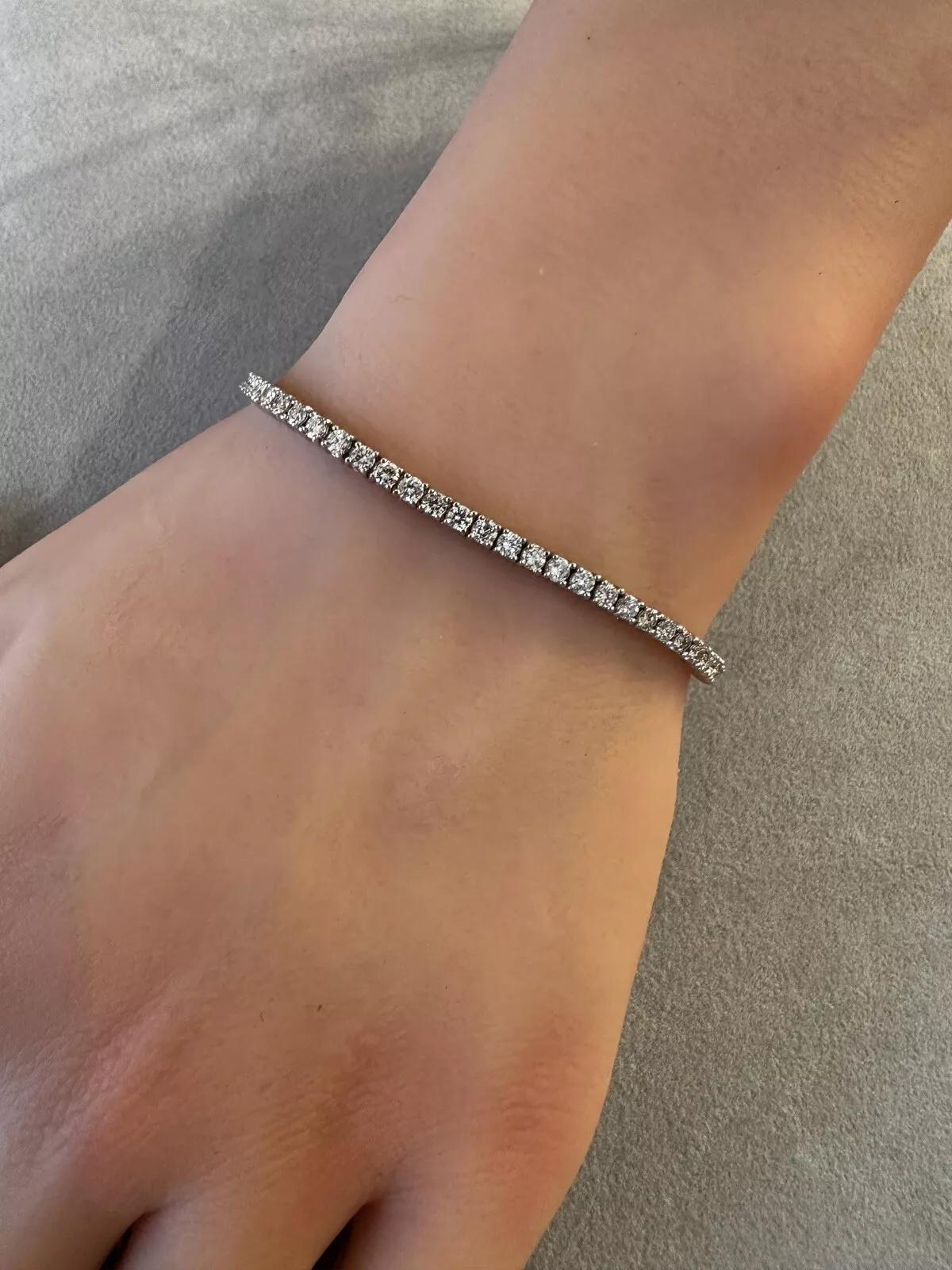 Round Brilliant Diamond Tennis Bracelet 2.90 cttw in 14k White Gold

Diamond Tennis Bracelet features Natural Round Brilliant Diamonds prong set in 14k White Gold. The bracelet is secured by a snap closure with 2 safety clasps.

Total diamond weight
