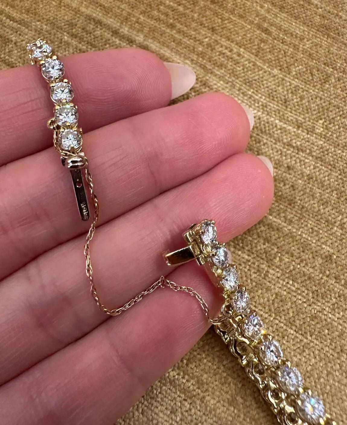 Round Brilliant Diamond Tennis Bracelet 9.00 Carat Total Weight in 18k Yellow Gold

Classic Diamond Tennis Bracelet features 38 Round Brilliant Diamonds prong set in 18k Yellow Gold. Bracelet is secured by a tongue clasp with safety bar and
