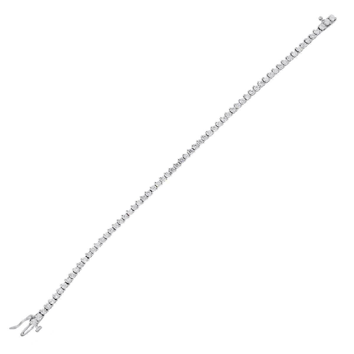 Material: 14k white gold
Diamond Details: Approximately 3.5ctw round brilliant diamonds. Diamonds are G/H in color and SI in clarity.
Clasp: Tongue in box clasp
Measurements: 7″
Total Weight: 9.9g (6.3dwt)
SKU: G7197