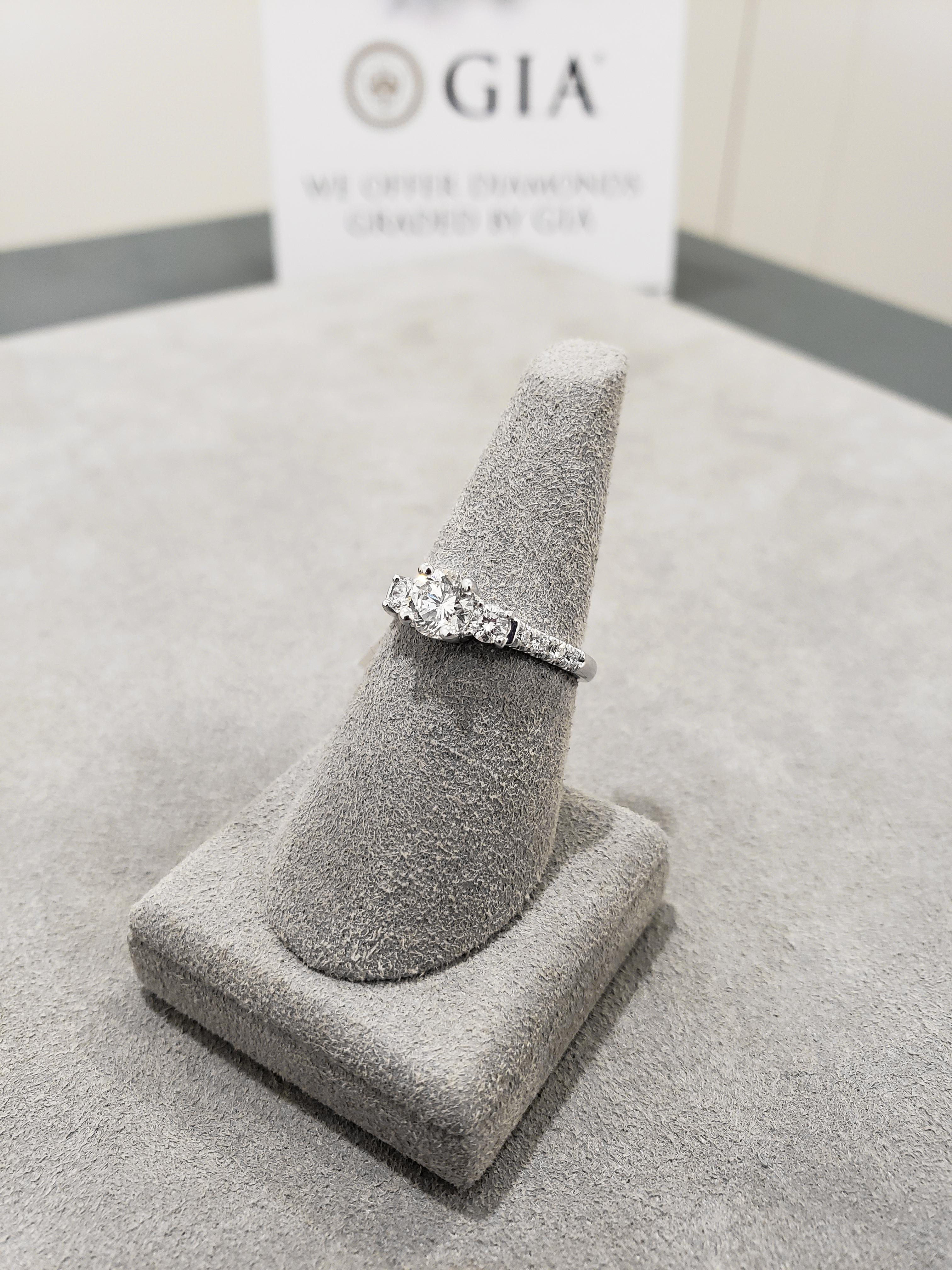 Contemporary Round Brilliant Diamond Three-Stone Pave Engagement Ring