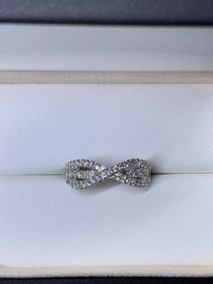 Round brilliant diamond twisted pave setting engagement ring wedding band in 18c