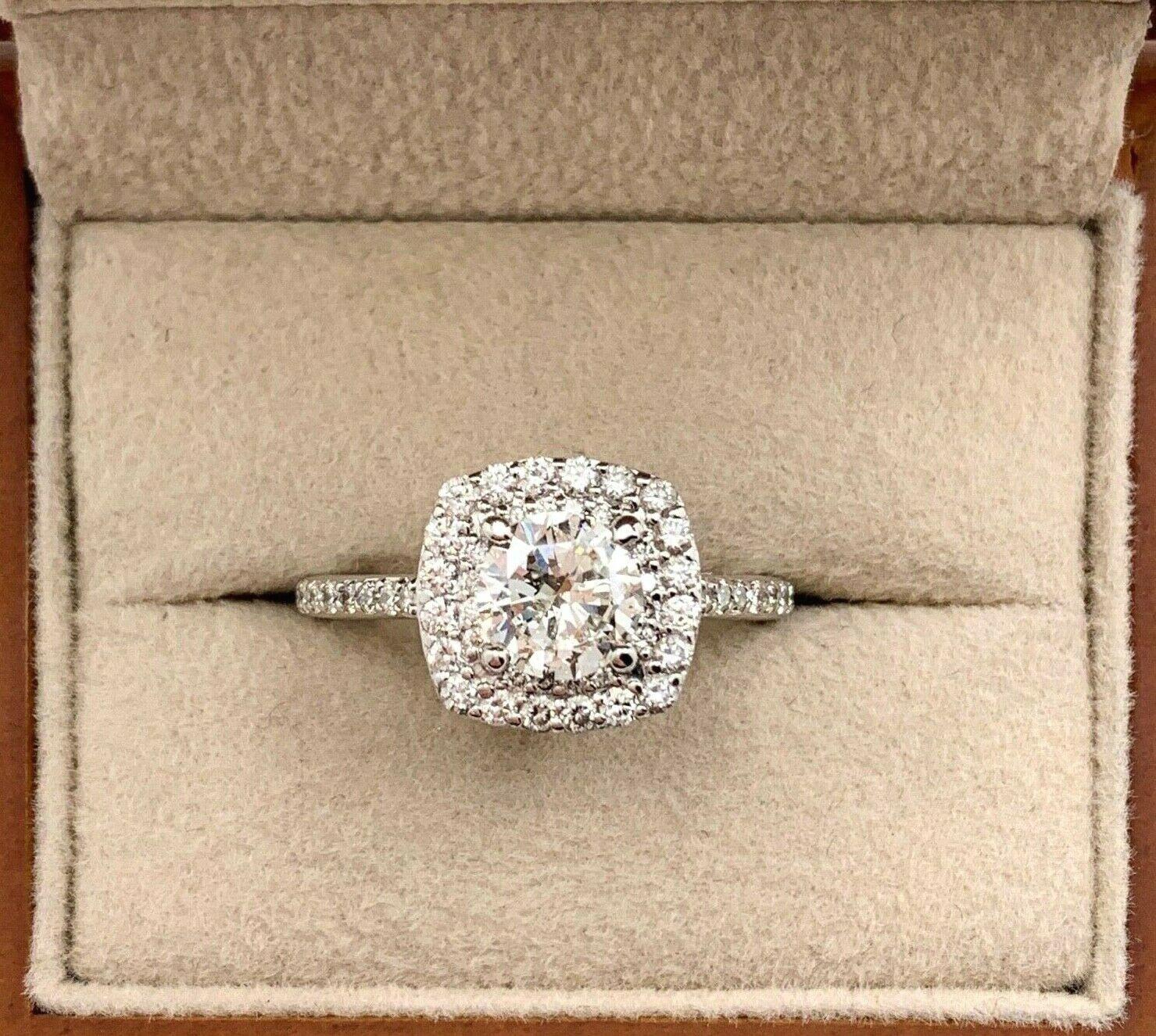 Round Brilliant Diamond Engagement Ring

Style:  Double Halo
Metal:  14K White Gold
Size / Measurements:  Ring Size 6.5
TCW:  1.31 Carats Total
Main Diamond:  0.86 Carat Round Brilliant Cut
Color & Clarity:  G Color,  I1 Clarity
Accent Diamonds:  53