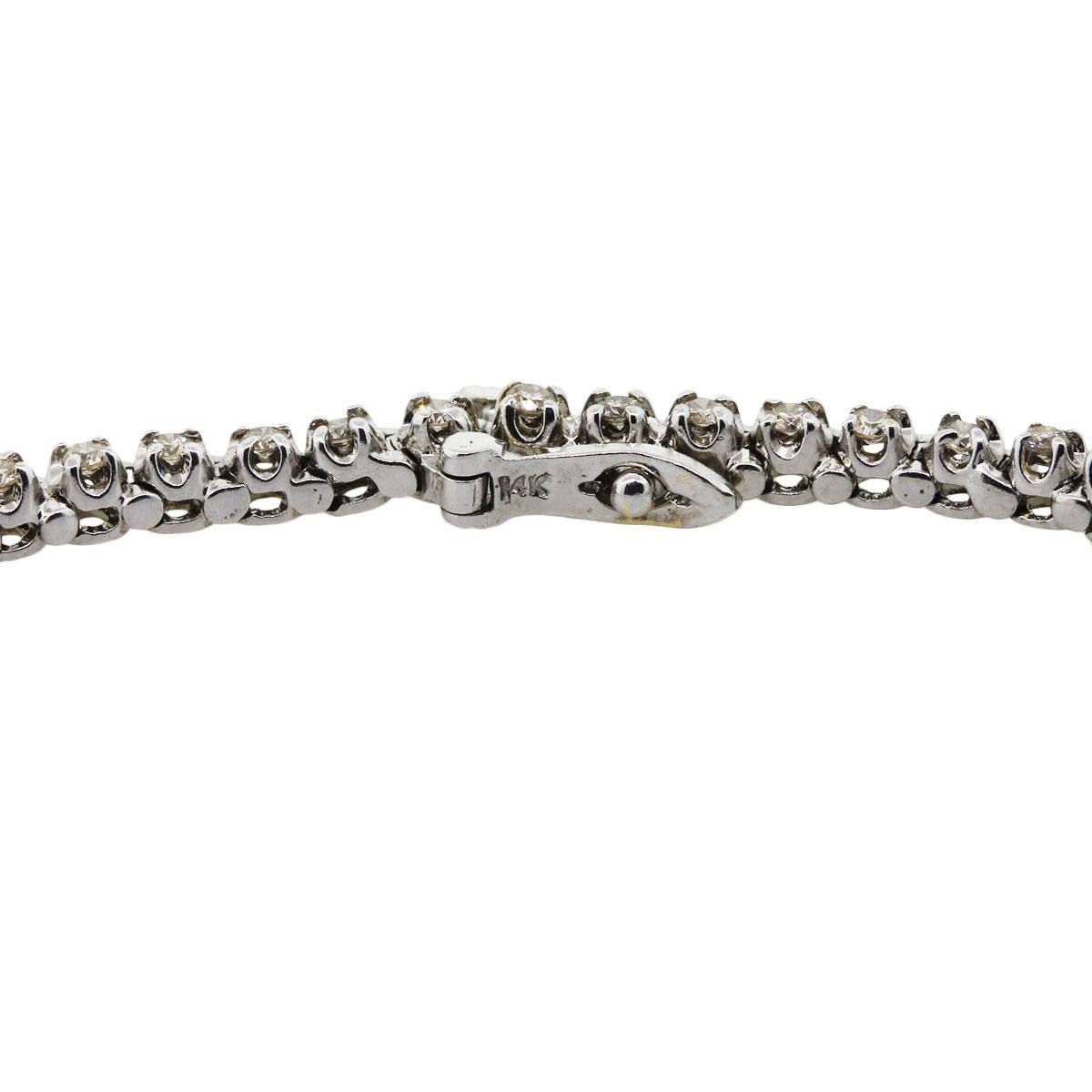 Material: 14k white gold
Diamond Details: Approximately 7ctw of round brilliant graduated diamonds. Diamonds range from I-K in color, SI in clarity
Measurements: Necklace measures 16″ in length
Fastening: Tongue in box clasp with safety latch
Item