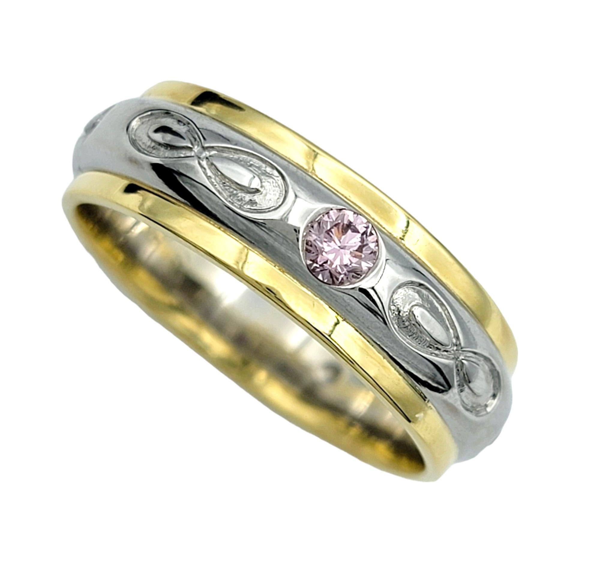 Ring Size: 10.75

This stunning band ring was beautifully crafted in 18 karat yellow gold and platinum, the combination of metals adds a luxurious touch to the design while ensuring durability and longevity. At the heart of the ring lies a single