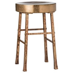 Tabouret rond avec pieds en bronze forgé et martelé