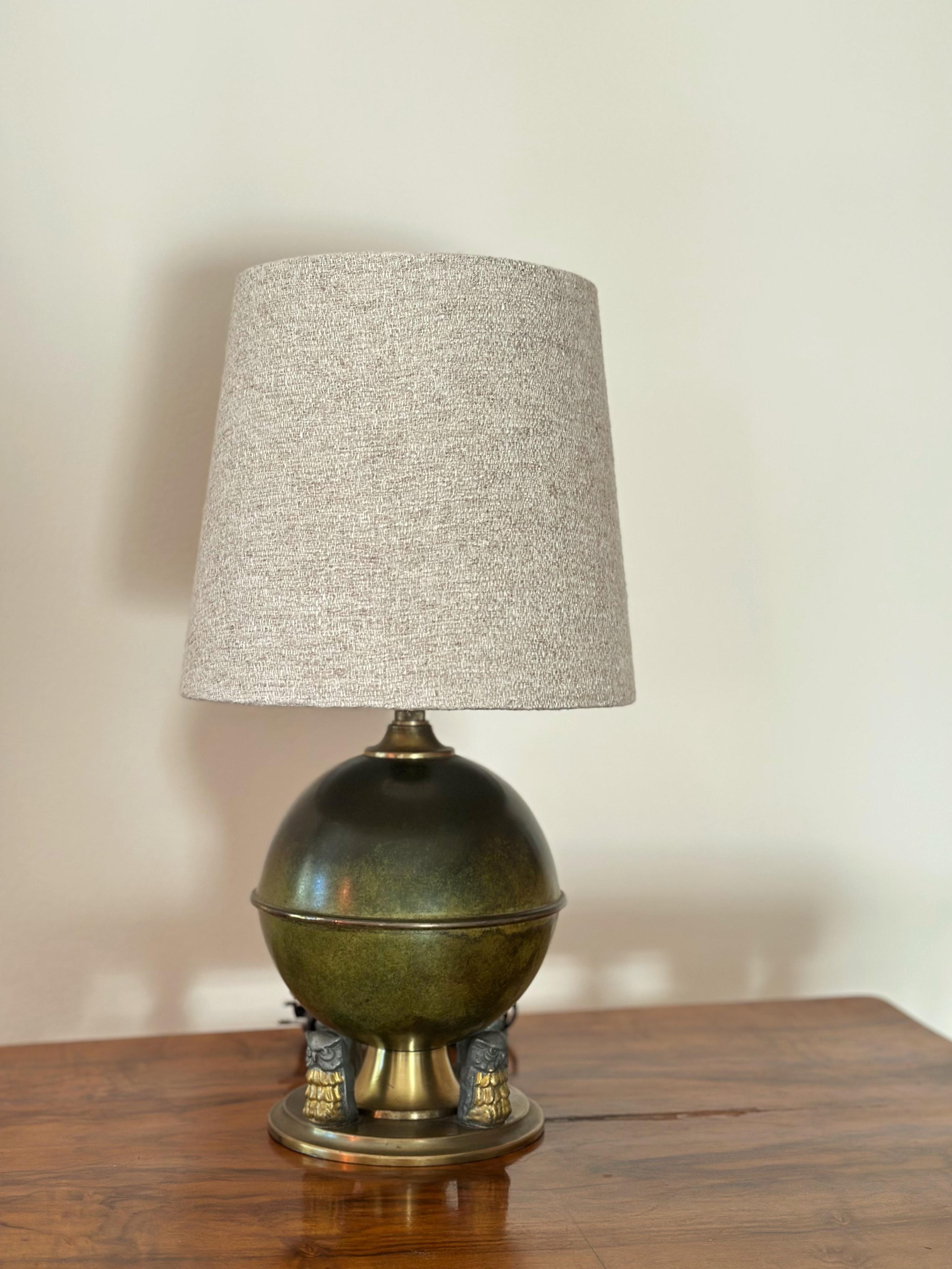 Elegant Swedish Art Deco Bronze Table Lamp with three distinctive feets. A Round Bronze Table Lamp designed and manufactured in Sweden during the 1930’s.

Bronze Table Lamp with a spherical body on a platform of three legs in the form of owls, in