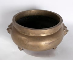 Round Bronze Vessel with Two-Sided Decoration and Foot-Shaped Feet
