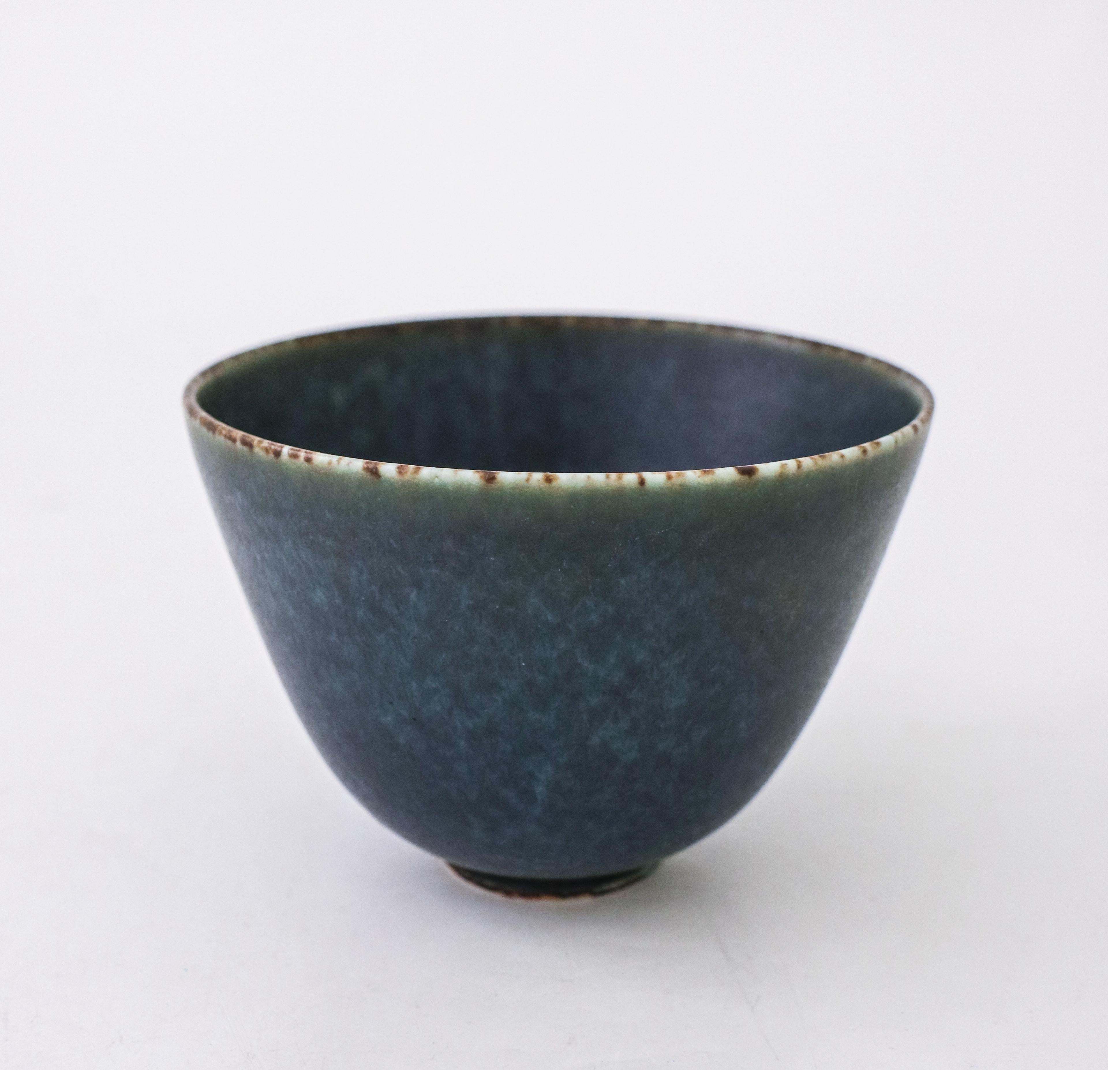 A dark blue bowl designed by Gunnar Nylund at Rörstrand, the bowl is 9 cm (3.6