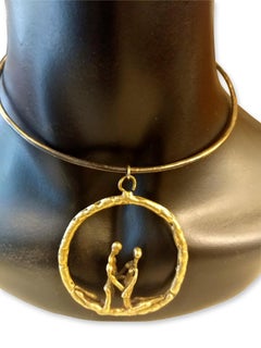Round brutalist brass pendant with loving couple attributed to Pal Kepenyes