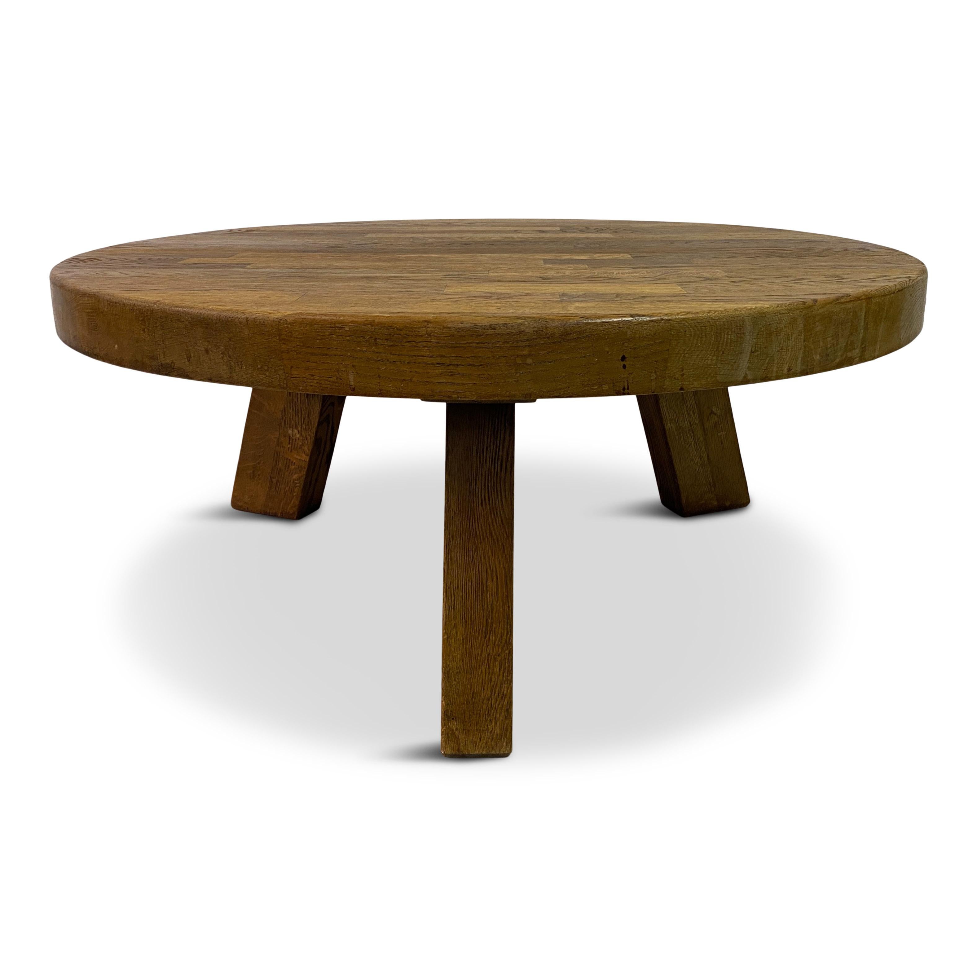 Round coffee table

Oak

Segmented top 

Thick oak legs

Flemish 1960s