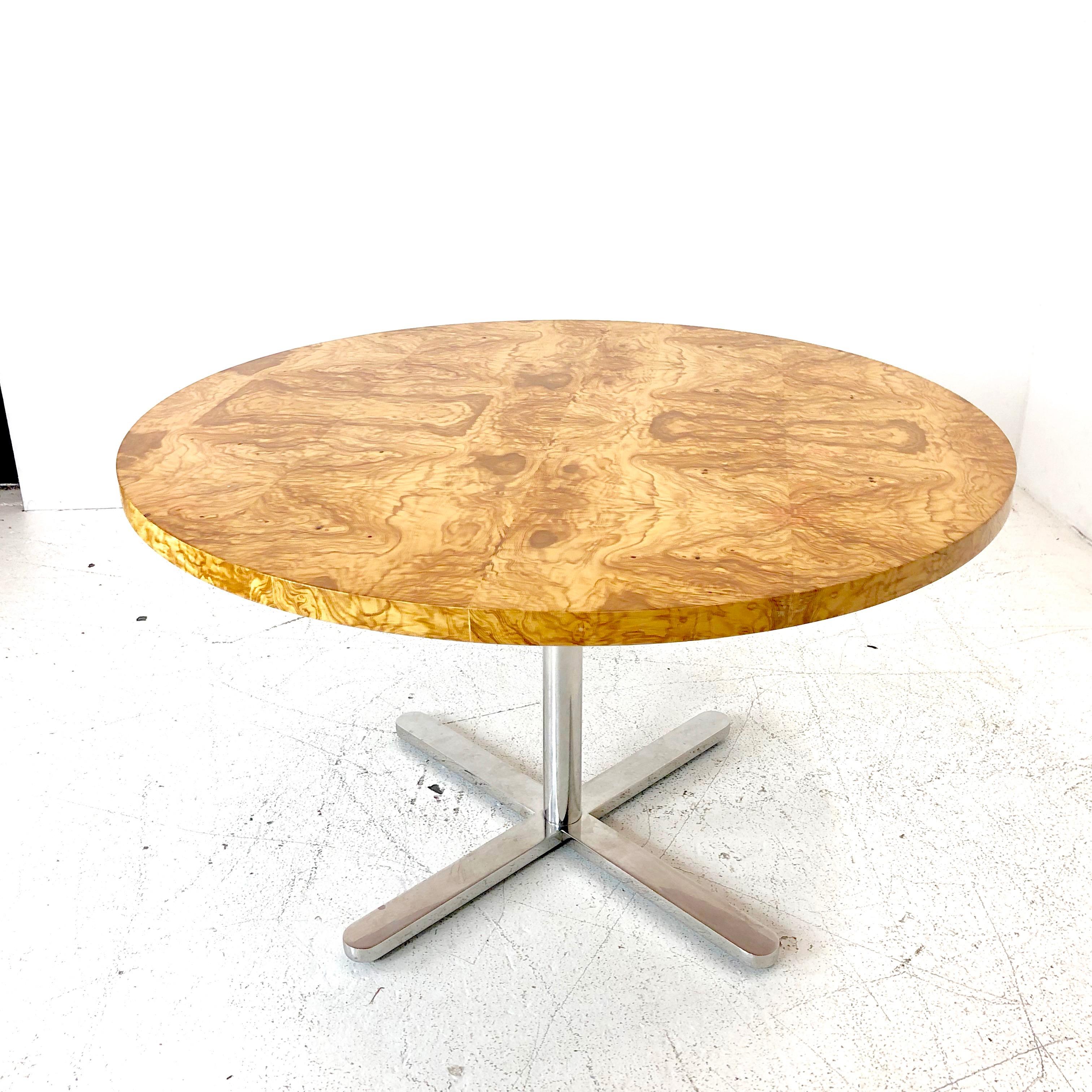 Round burl wood dining table with star pedestal base. Dining table is in good condition with some discoloration in the tables veneer and minor chipping around perimeter of the tabletop.
Dimensions:
48 diameter x 28.5 height.