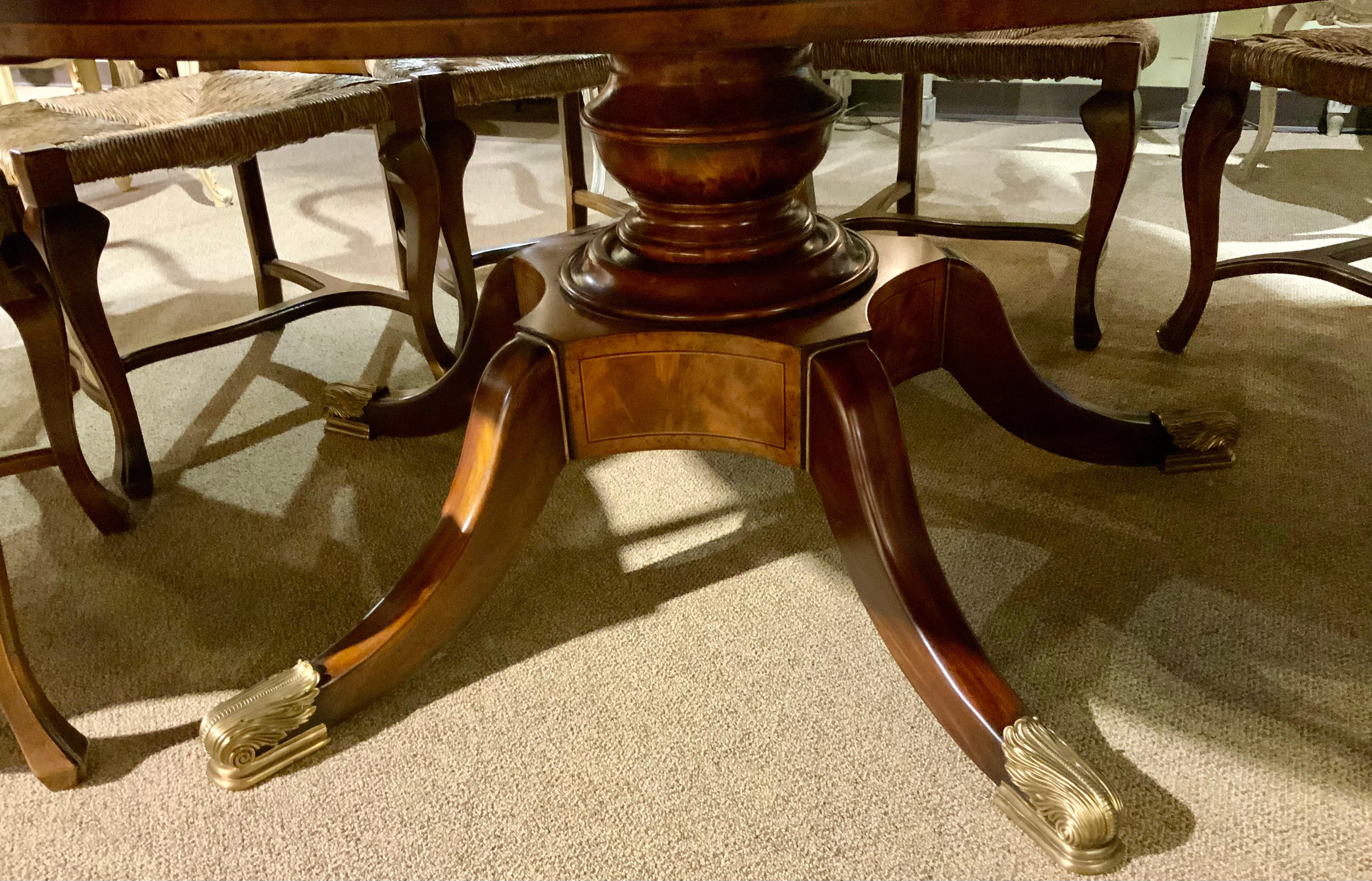 This table is unique because the leaves will fold underneath 
The table to form a smaller table while storing the folded
Leaves. The wood is a beautiful rich walnut color. It will
Seat eight people easily. The diameter when it is reduced
Is 61”