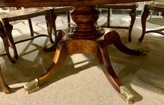 Round burled wood  Jupe dining table by Theodore Alexander