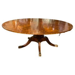 Round burled wood  Jupe dining table by Theodore Alexander
