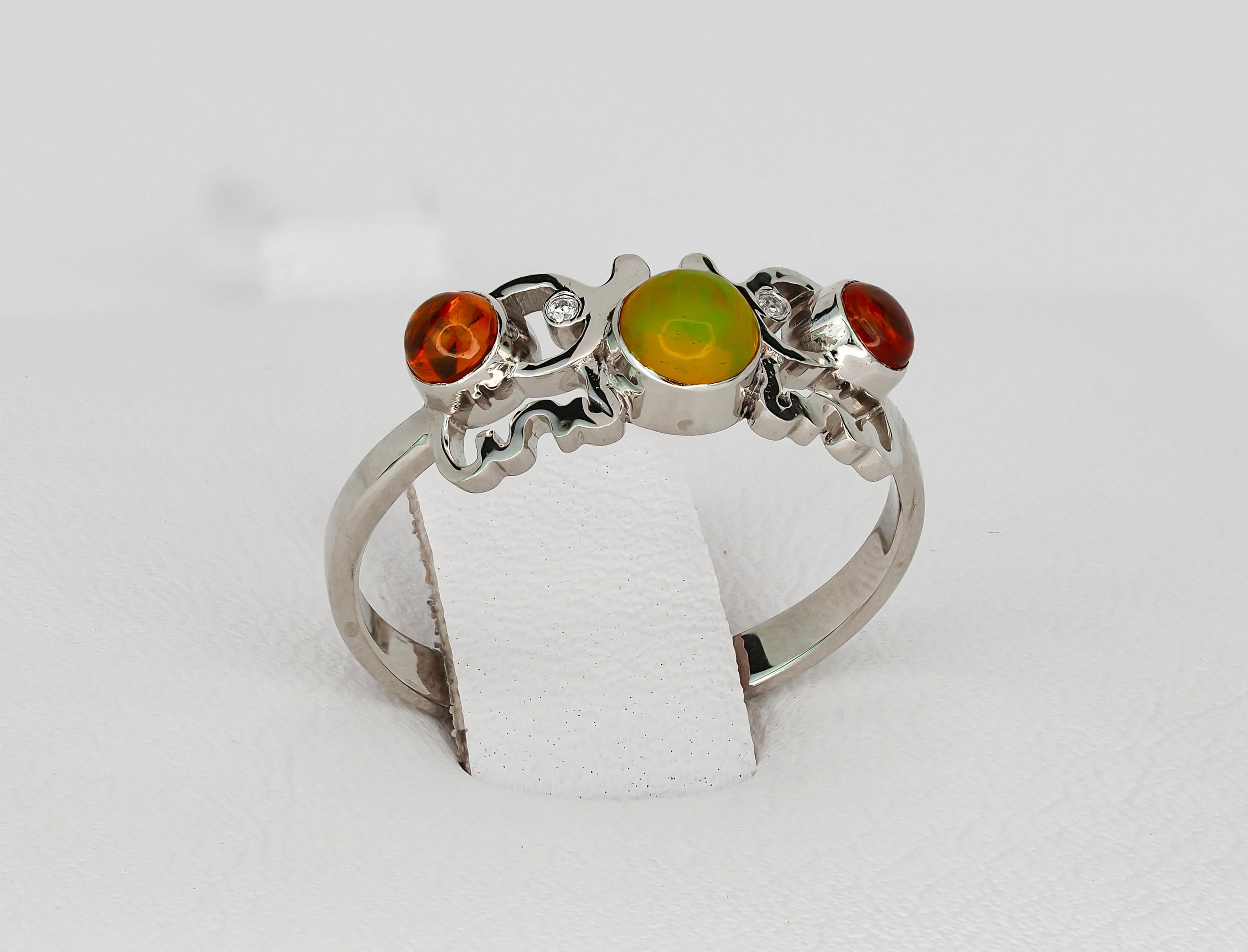 Modern Round cabochon opal ring in 14k gold.  For Sale