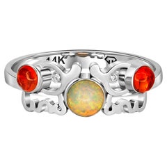 Round cabochon opal ring in 14k gold. 