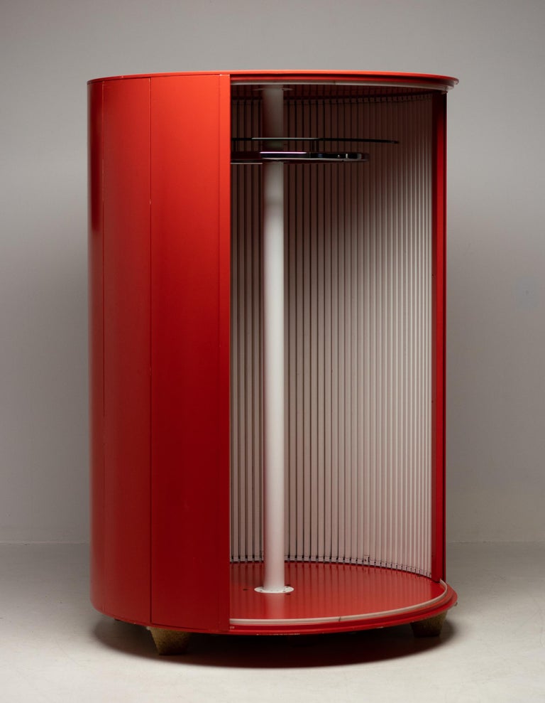 This very large wardrobe came from an Italian villa decorated with numerous designer pieces from the 1960's and 70's. Many pieces by Tobia Scarpa and Fontana Arte especially. The wardrobe has a rotating enameled steel center column with attached to