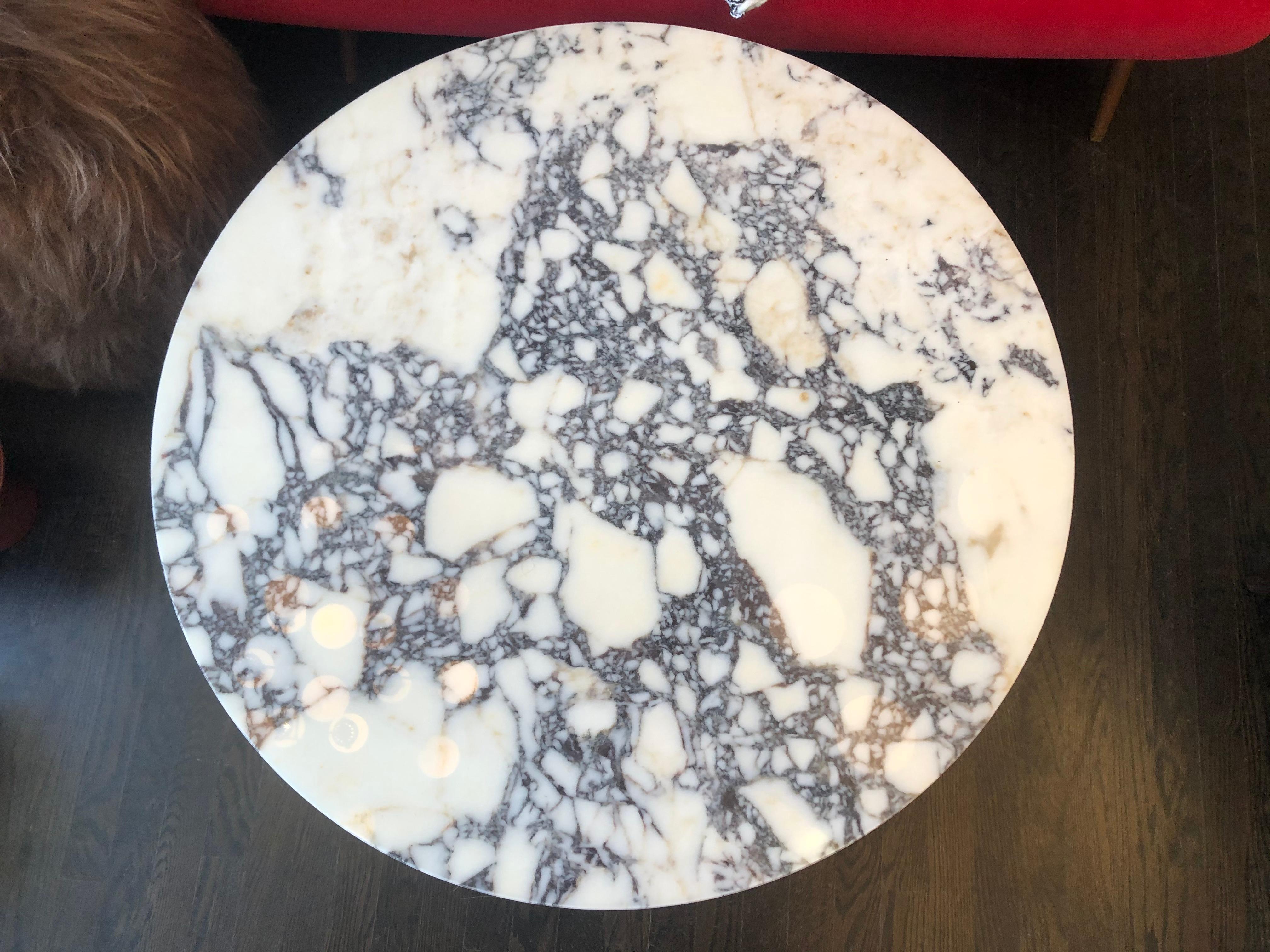Round Carrara marble coffee table by Le Lampade
Circular Carrara marble top standing on red marble hexagonal base 
The table can be custom made and the lead time is three weeks.