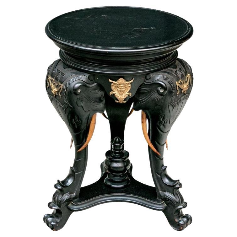Round Carved Elephant Head Ebonized Pedestal Table For Sale