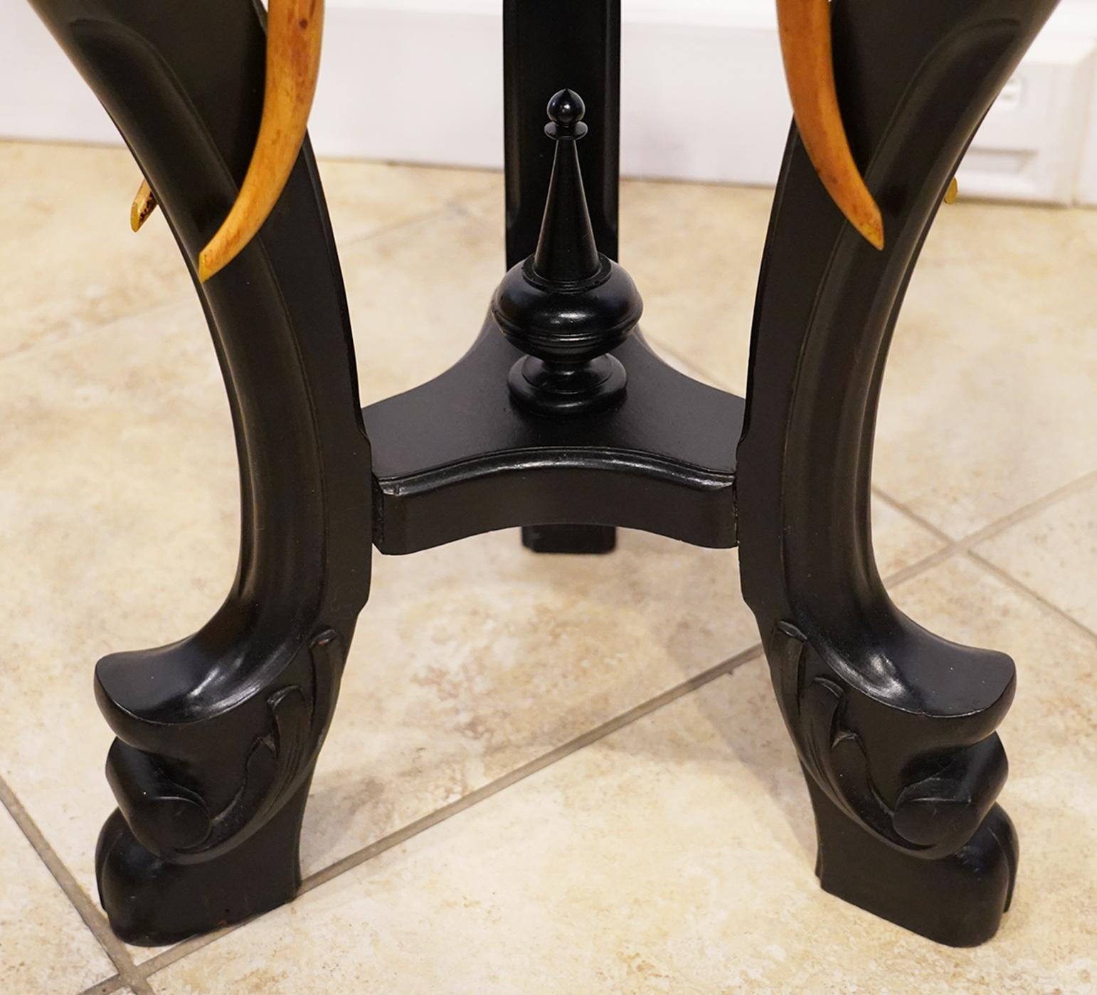 20th Century Round Carved Three Elephant Heads Rotating Top Ebonized Pedestal by R. J. Horner