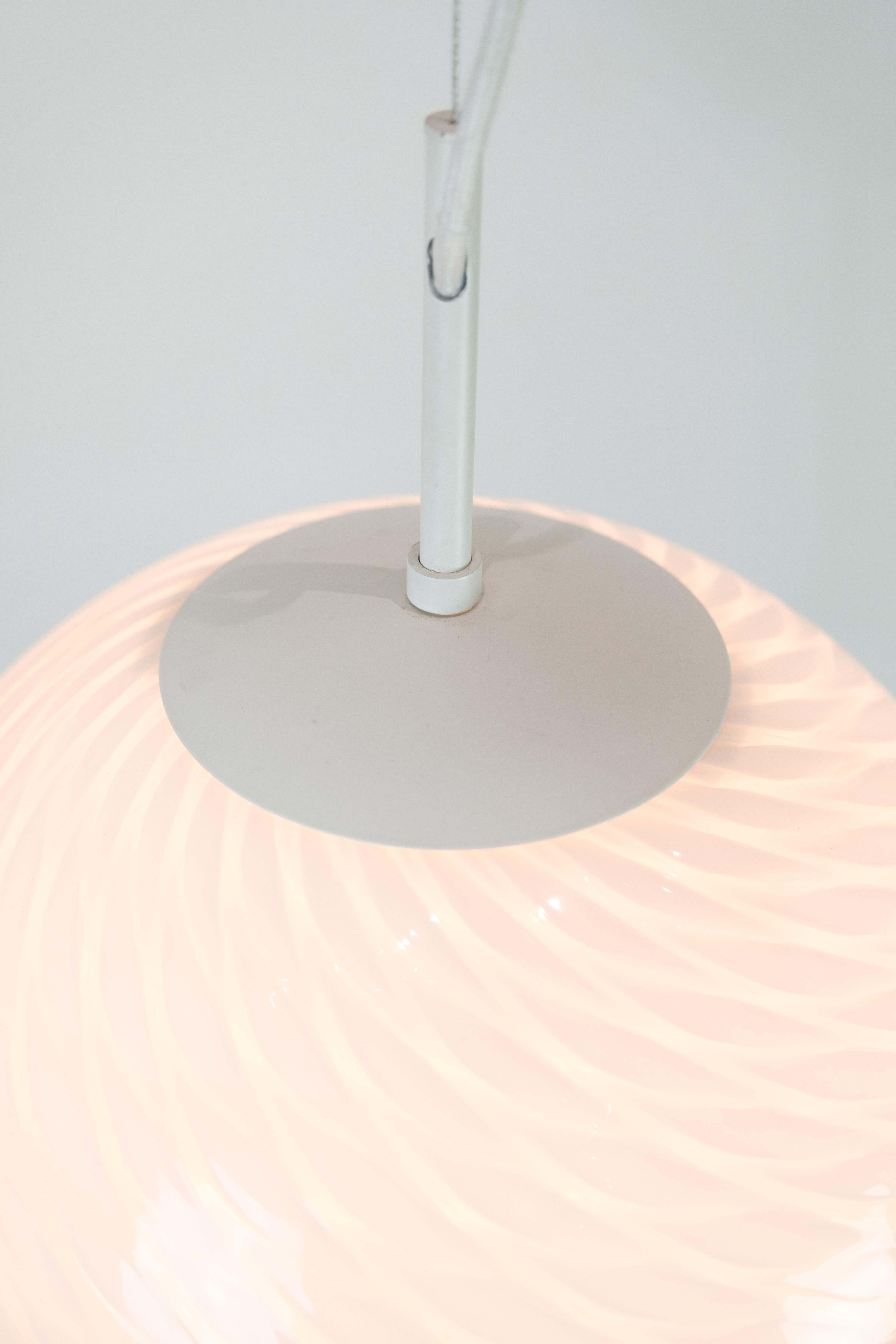 Modern round ceiling lamp made of patterned Verano Italian glass.
Measurements in cm: H: 38 Dia: 38