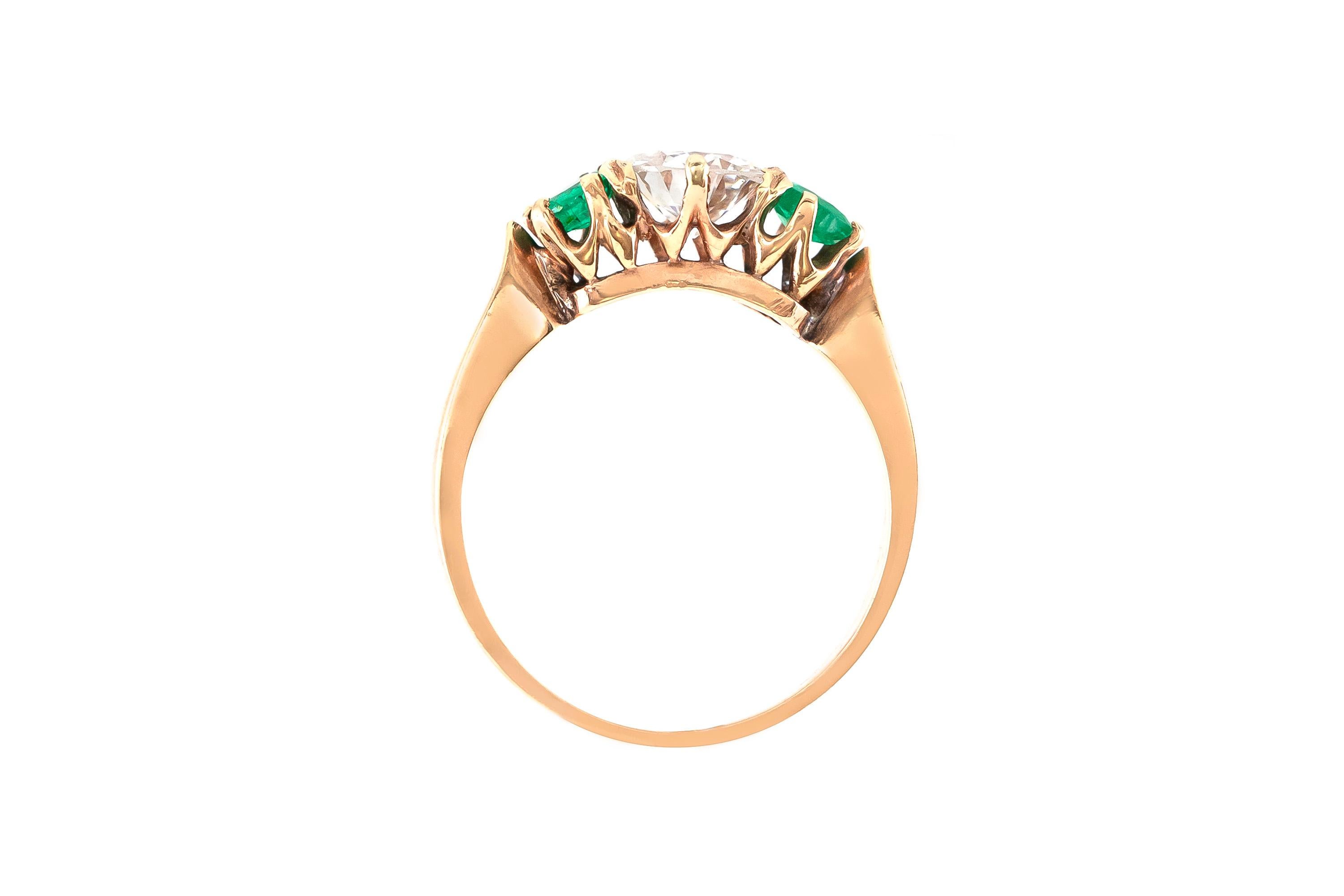 The ring is finely crafted in 14k yellow gold with center dimond weighing approximately total of 0.77 carat Color G and Clarity and with two emerald weighing approximately total of .50 carat.
Circa 1940.