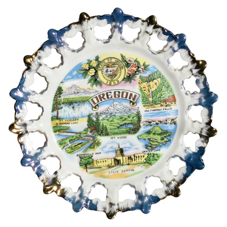 Round Ceramic Decorative Souvenir Tourist Plate from Oregon in Blue and Gold