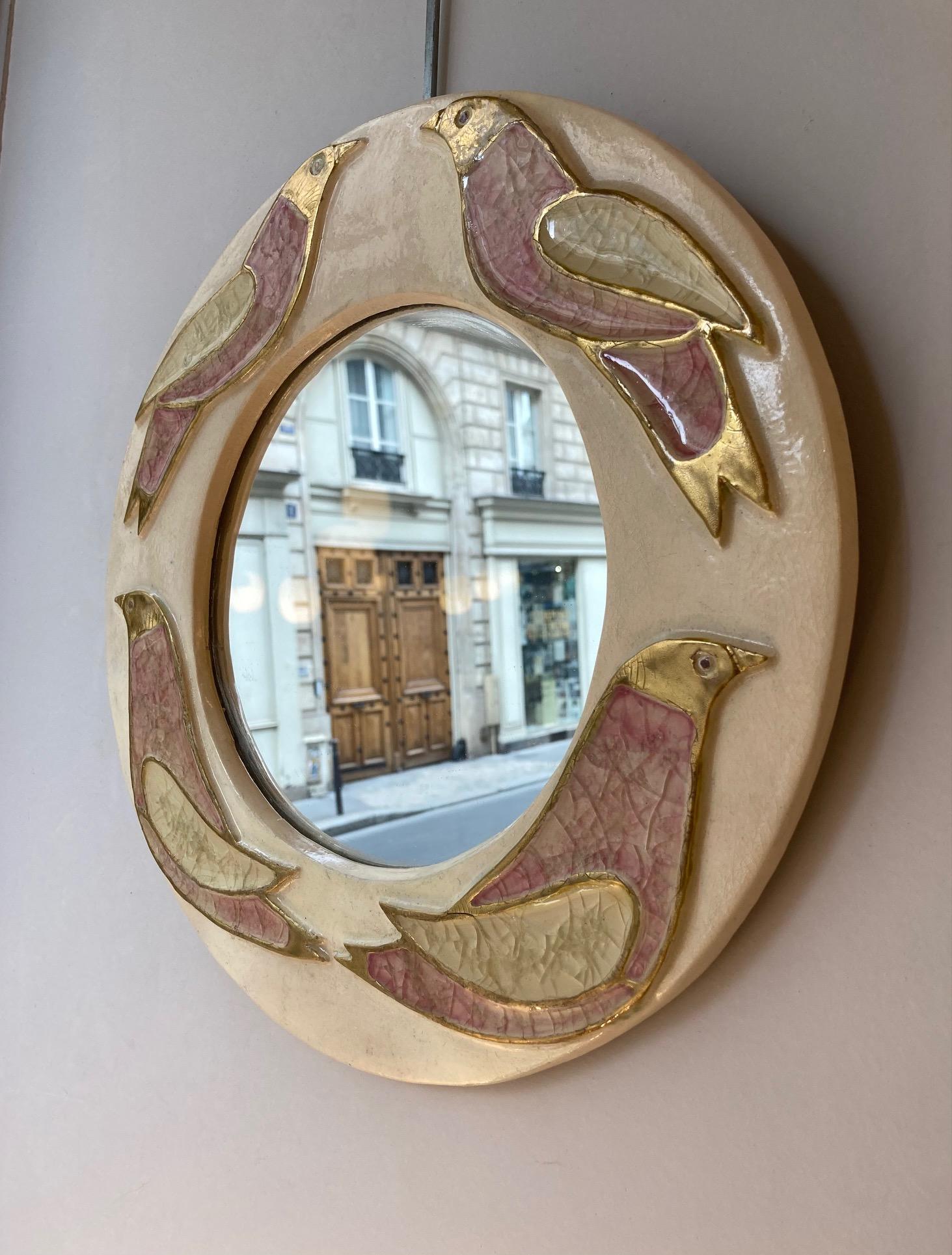 A round ceramic wall mirror, 2 birds facing each other and 2 others being back to back.
Enameled in shades of ivory, light pink and gold.
Original green felt at the back, in very good condition.
Mithé Espelt (born 1923)
Lunel, south of