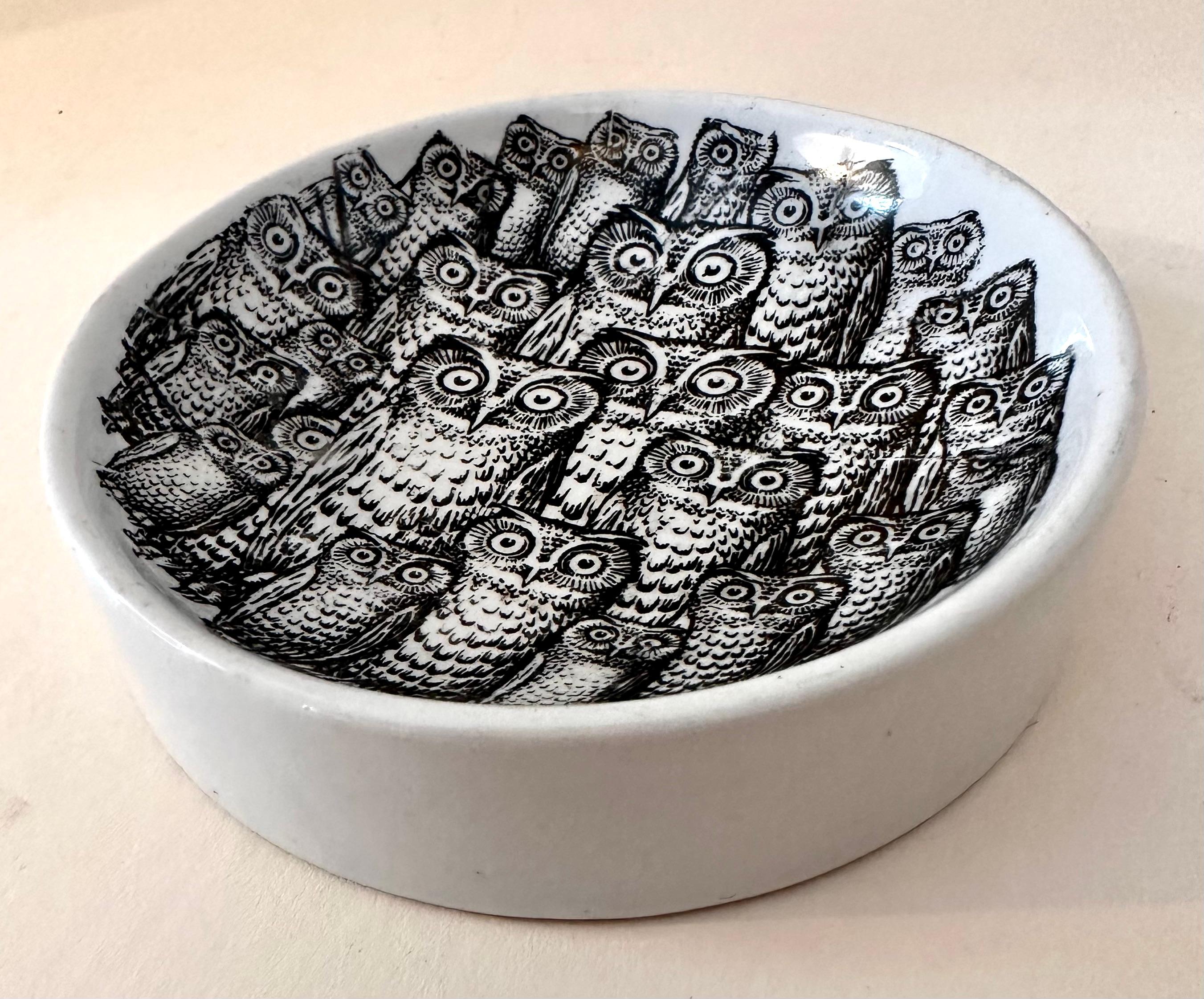 Porcelain shallow 5 inch bowl with Fornasetti Owls. While the piece is not signed we expect it is Fornasetti. A beautiful piece.

A wonderful bowl for decoration or to gather change or the keys at the front door.

Perfect house warming or