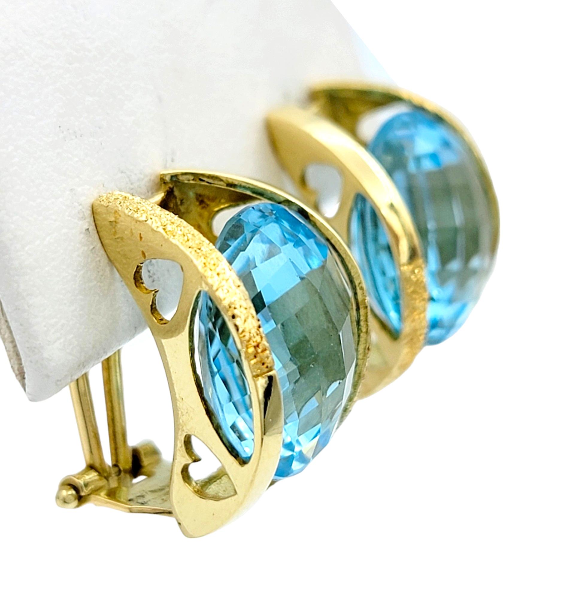 Round Cut Round Checkerboard Cut Blue Topaz Omega Back Earrings in 18 Karat Yellow Gold For Sale