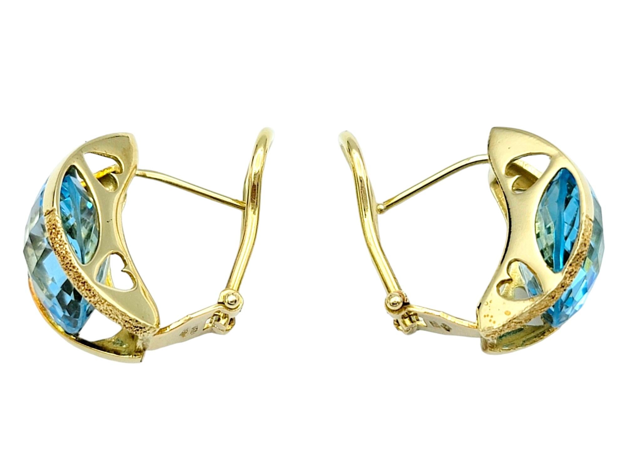 Women's Round Checkerboard Cut Blue Topaz Omega Back Earrings in 18 Karat Yellow Gold For Sale