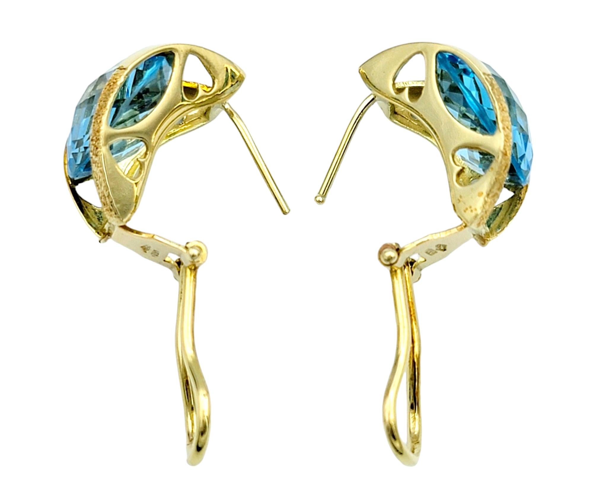 Round Checkerboard Cut Blue Topaz Omega Back Earrings in 18 Karat Yellow Gold For Sale 1