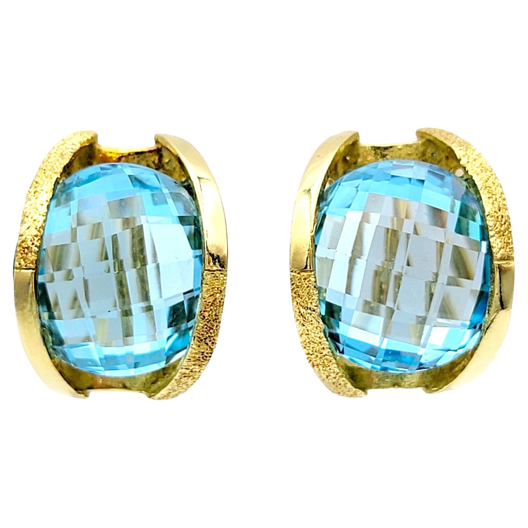 Round Checkerboard Cut Blue Topaz Omega Back Earrings in 18 Karat Yellow Gold For Sale