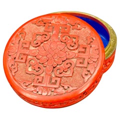 Round Chinese Box in Carved Red Lacquer Blue Enamel Interior