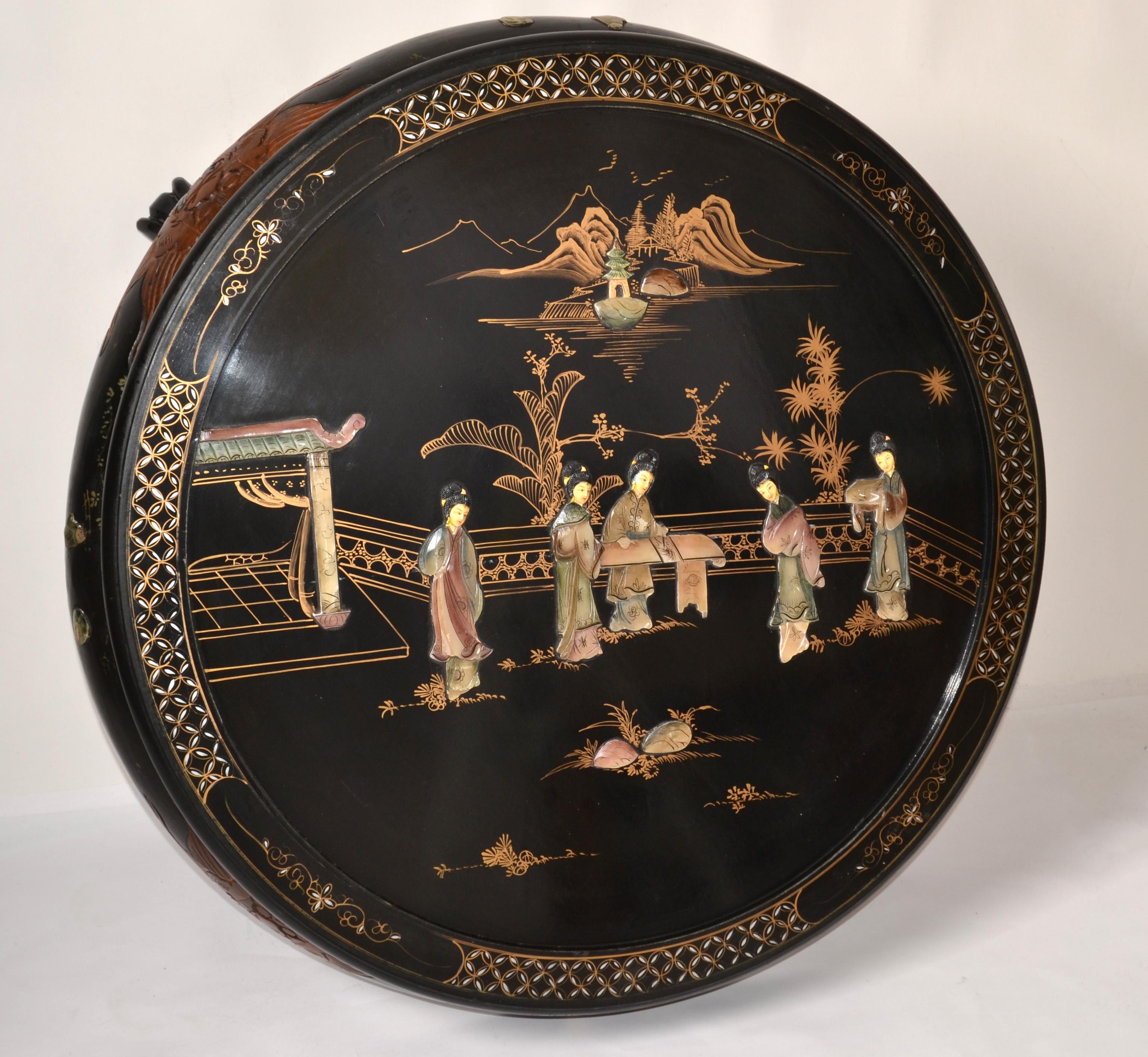 Add a charming touch of Oriental design to your décor with this stunning handcrafted black lacquer coffee table embossed with Jade stonework and Bone inlay. The women gathering in the center of this outstanding creation are reminiscent of the