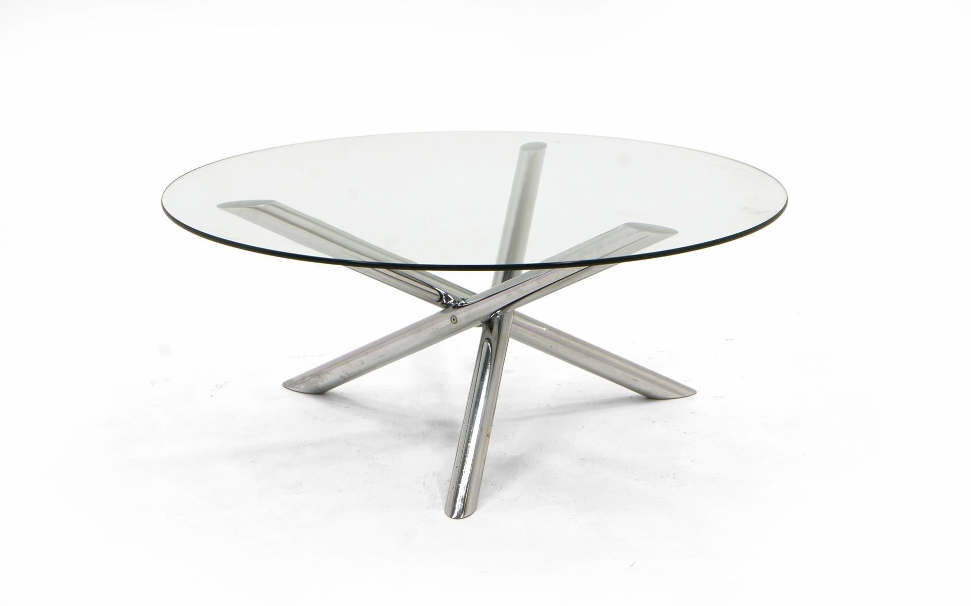 Round coffee table with a Jax style chrome base and glass top. Designer unknown.