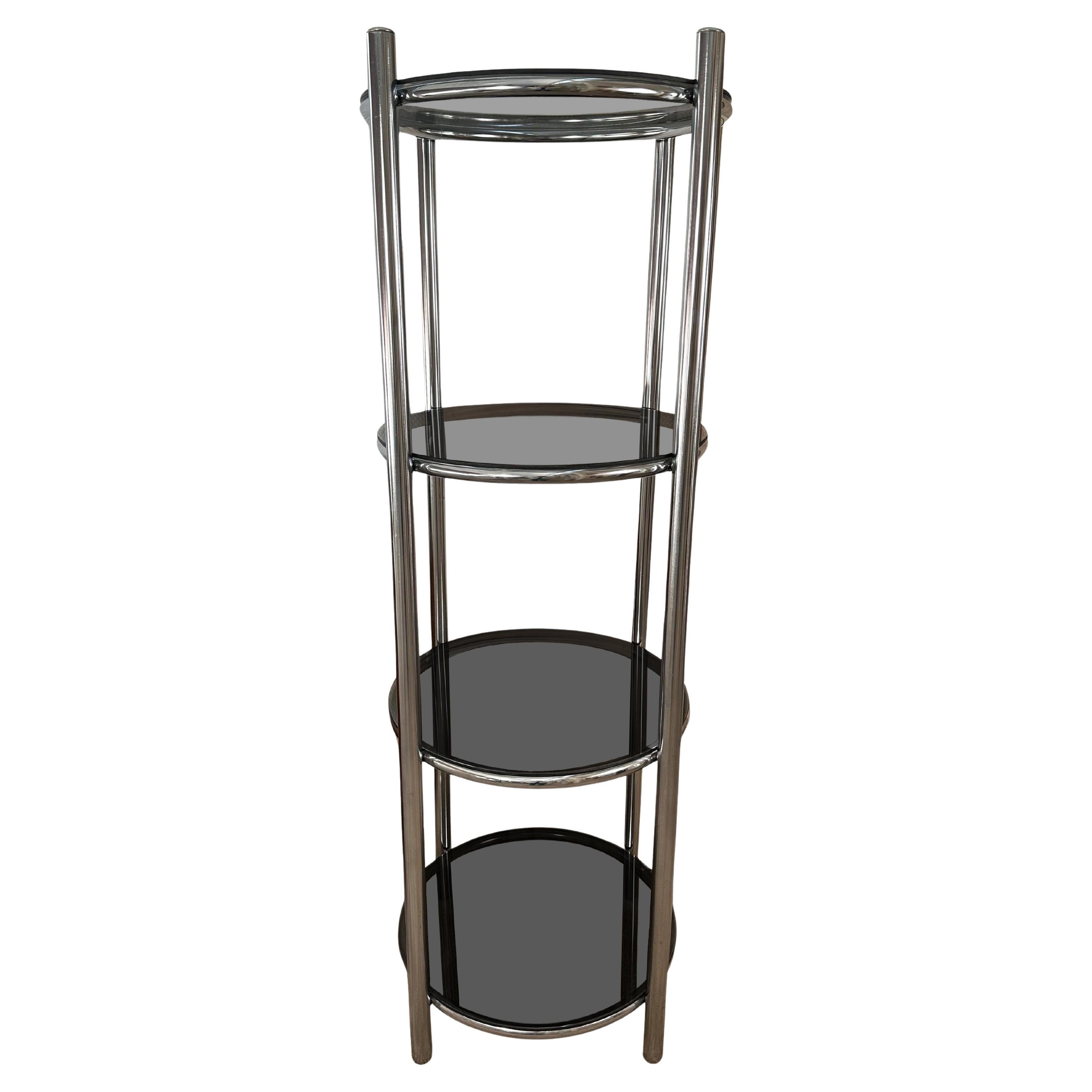 Étagère redonda cromada con estantes de cristal ahumado