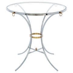 Gueridon rond en chrome avec accents en laiton et dessus en verre