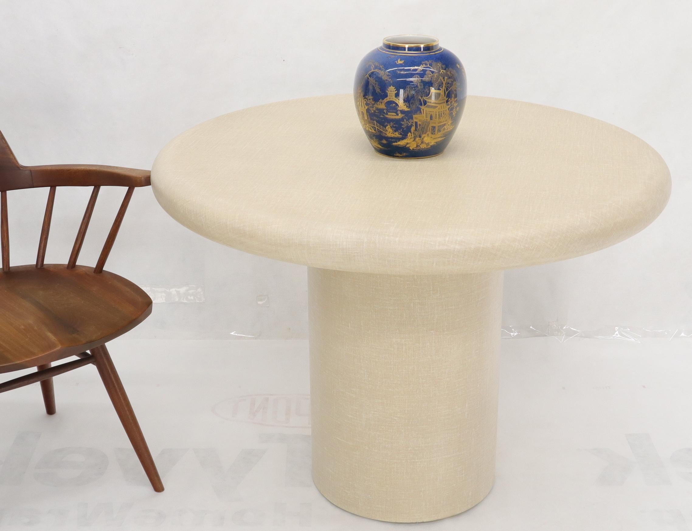 Mid-Century Modern dining or game cloth wrapped finish table on cylinder base.