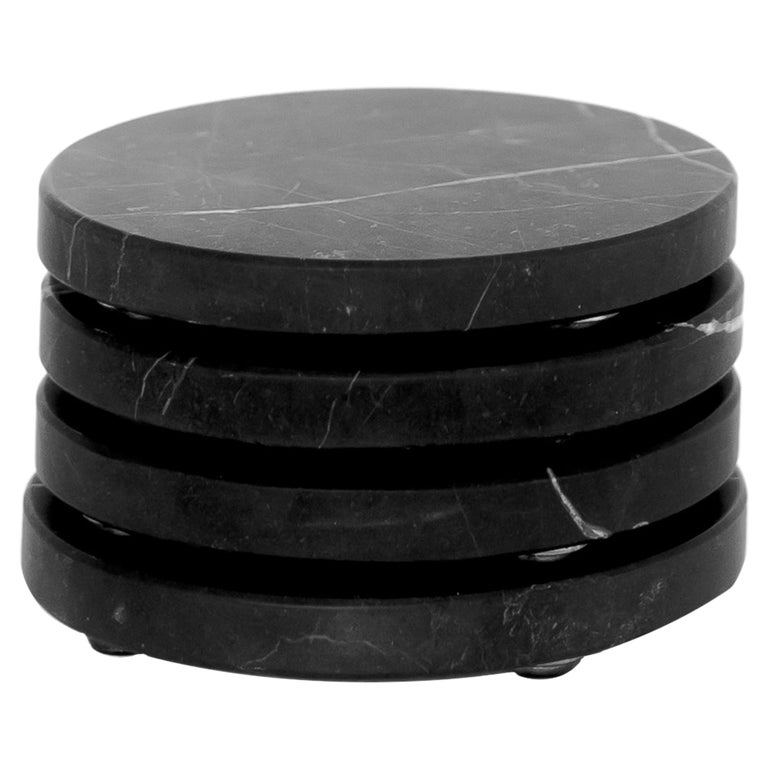 Round Coasters set in black marble For Sale