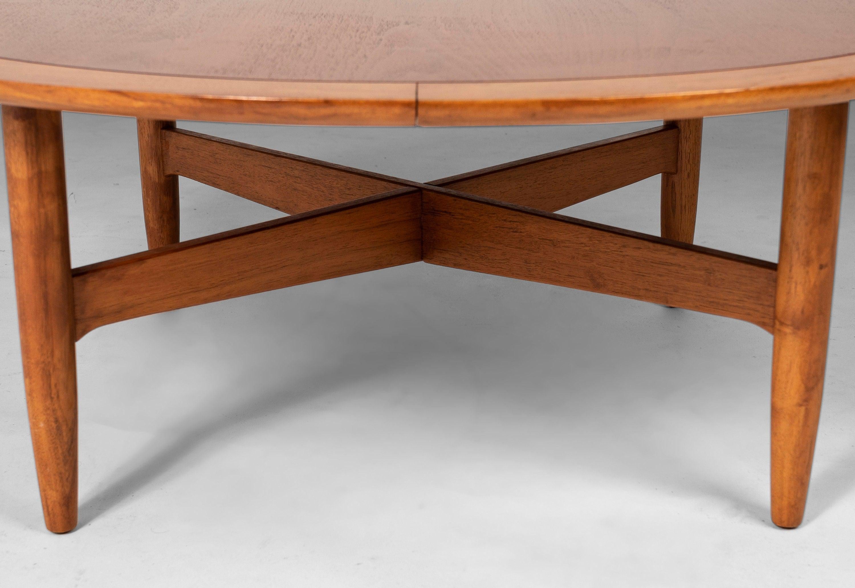 A truly exceptional build and architectural design. This coffee table is constructed from pecan having been created from a hand-picked selection of the finest cuts. A large round top provides ample room for drinks or coffee table books. The table is