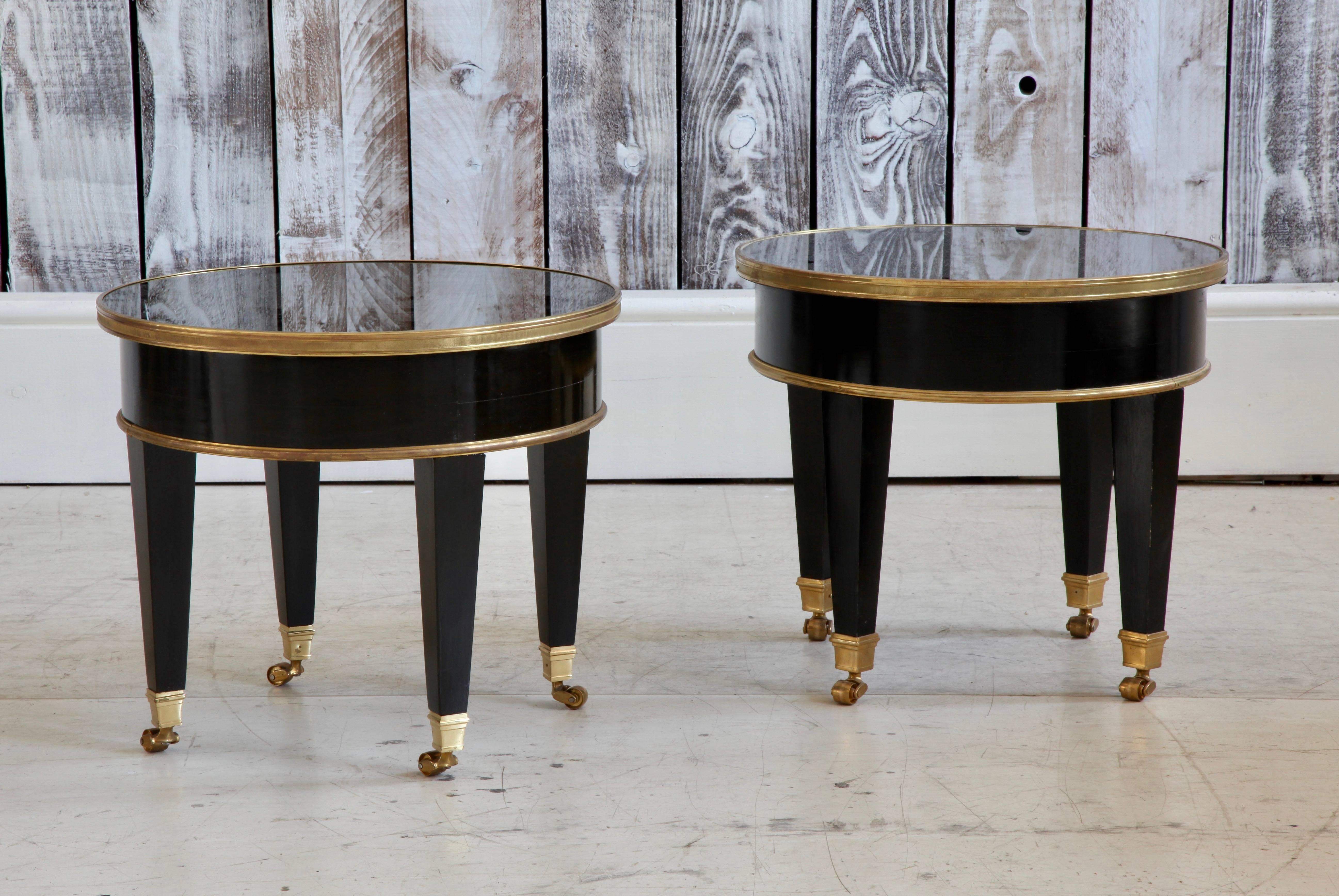 Coffee table or side table made in the style of Maison Jansen.
Black lacquer with bronze fittings and glass top.