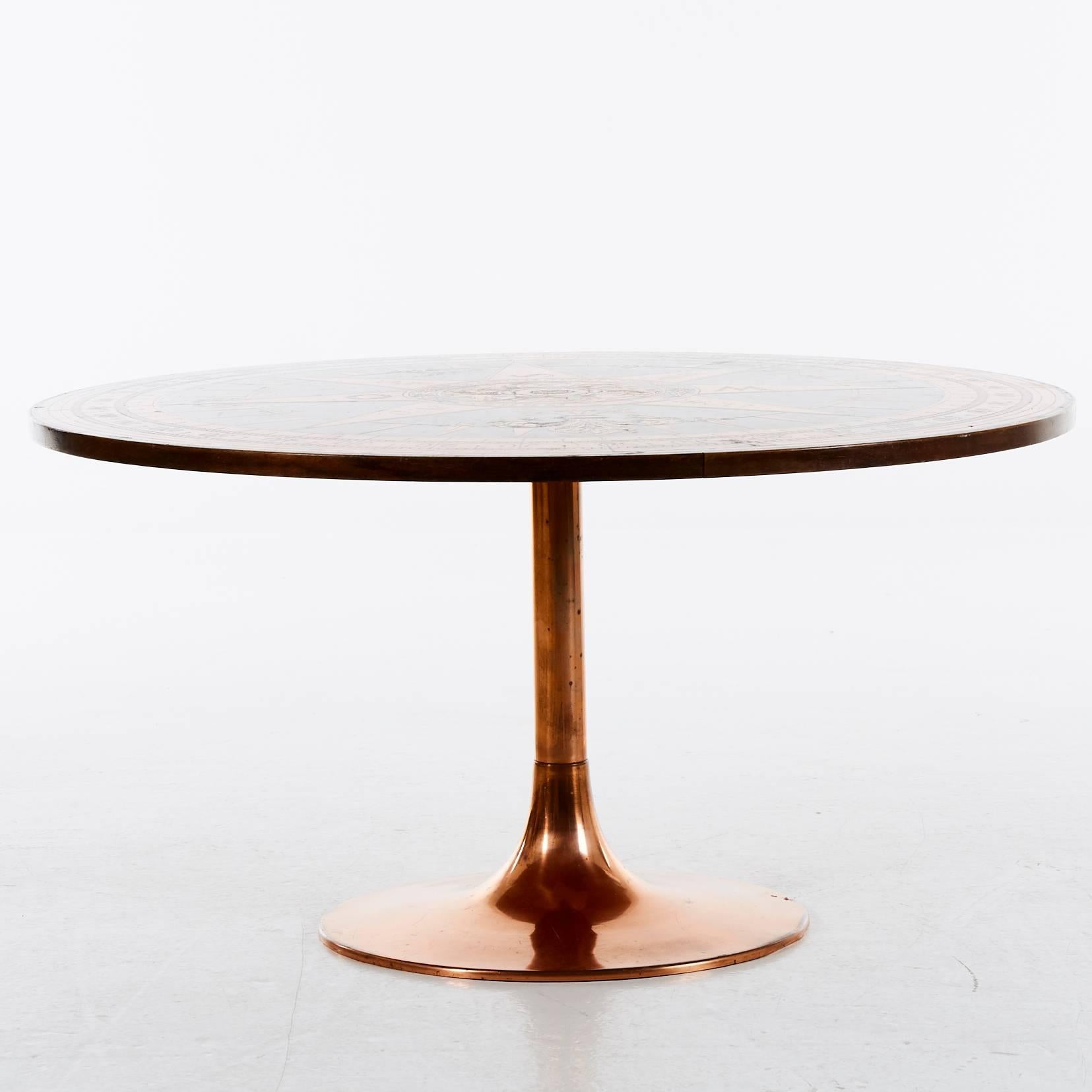 Side table, copper and woody metal, with compass decoration. Height about 52 cm, diameter about 100 cm. Condition: Occasional loss of copper color.