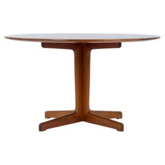 Round coffee table in mahogany and black formica by Grete Jalk