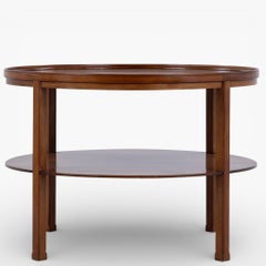 Round coffee table in mahogany by Kaare Klint