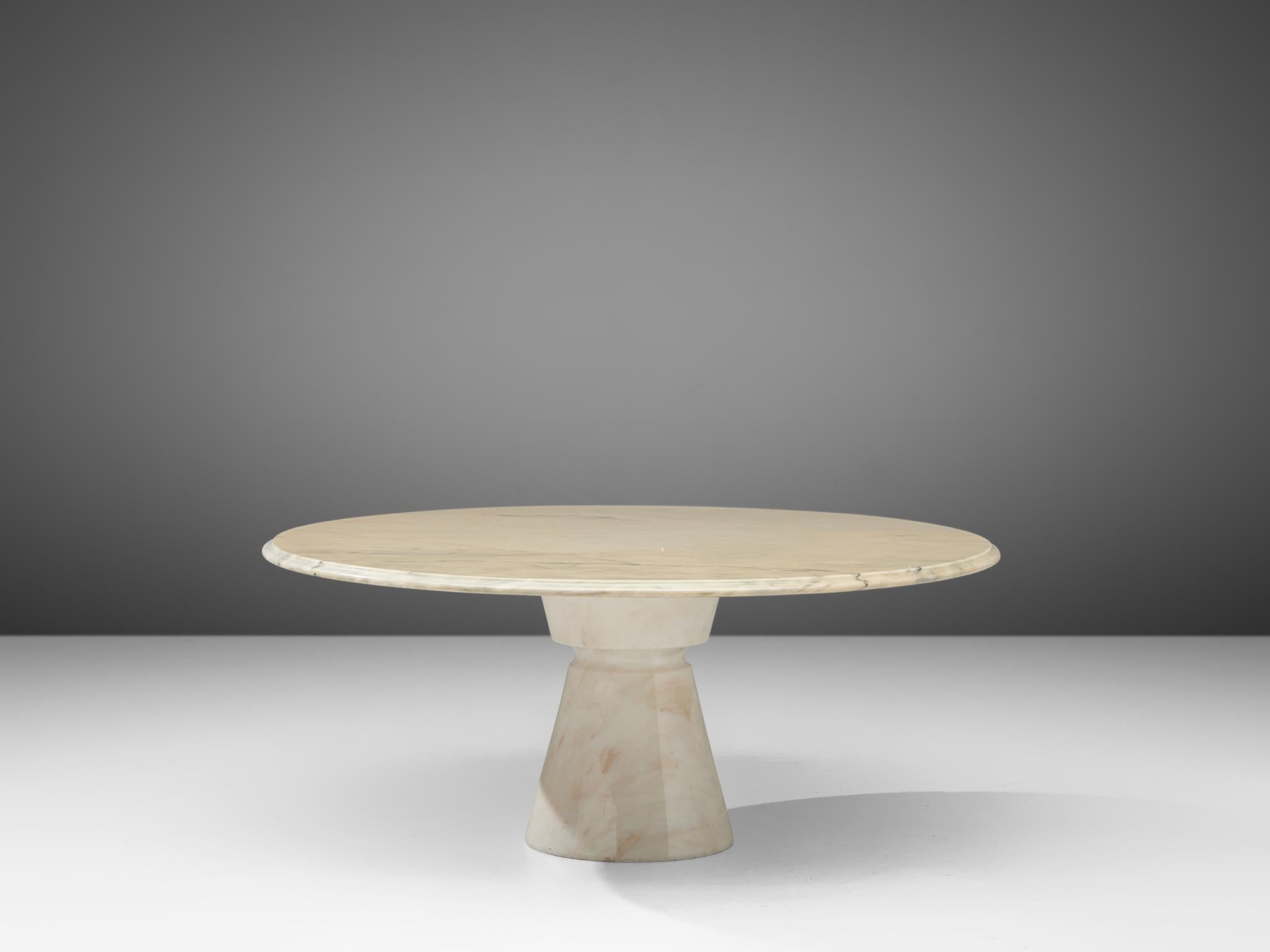 Coffee table, marble, Italy, 1970s

This strong cocktail table features a column foot and a thick round tabletop. The aesthetics are archetypical for postmodern design, bearing references to architectural forms such as the column foot. The table