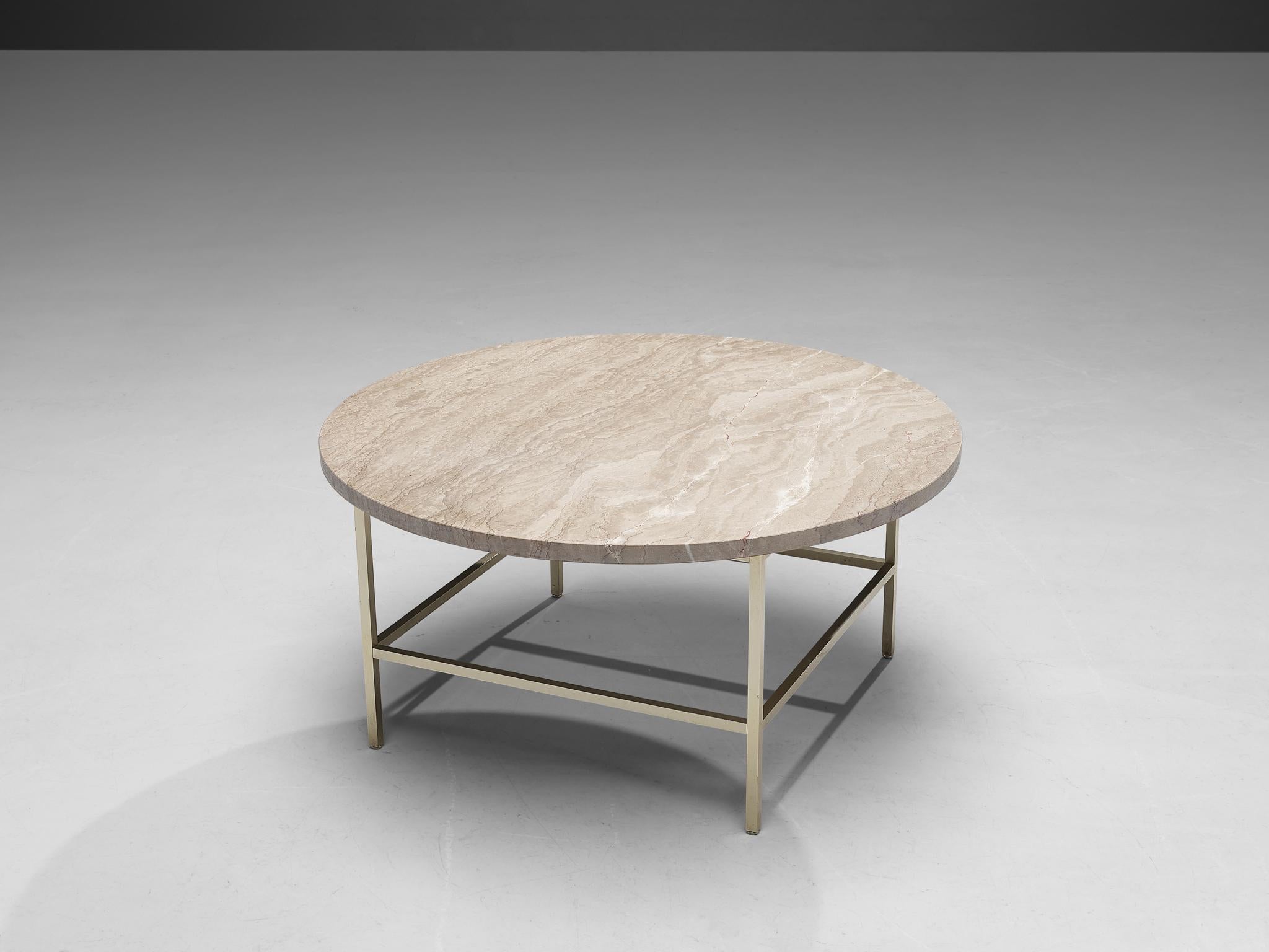 Round coffee table, marble, metal, United States, 1950s

This modest side table radiates pure elegance and strongly resembles designs of Paul McCobb. The table features a round beige marble top and is architectural in its structure. The table rests